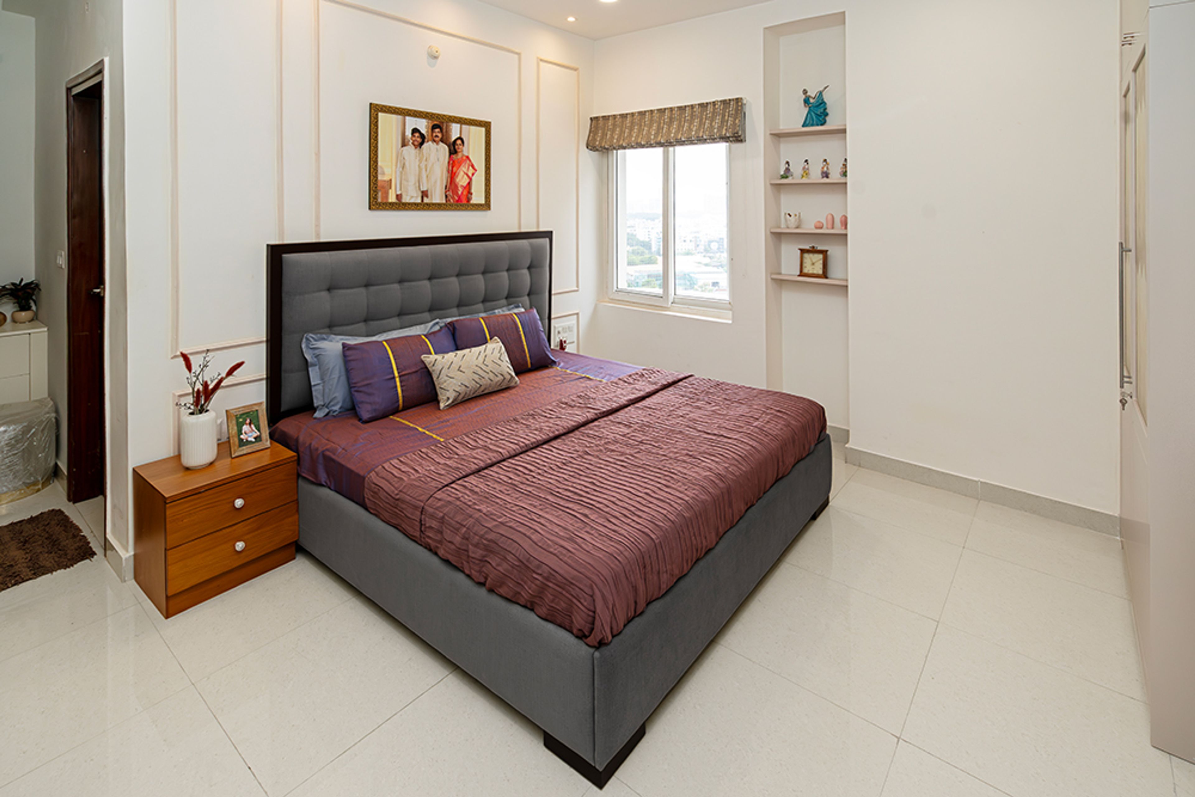 Bedroom Design with Grey Tufted Headboard Bed and Cream Wall Niches