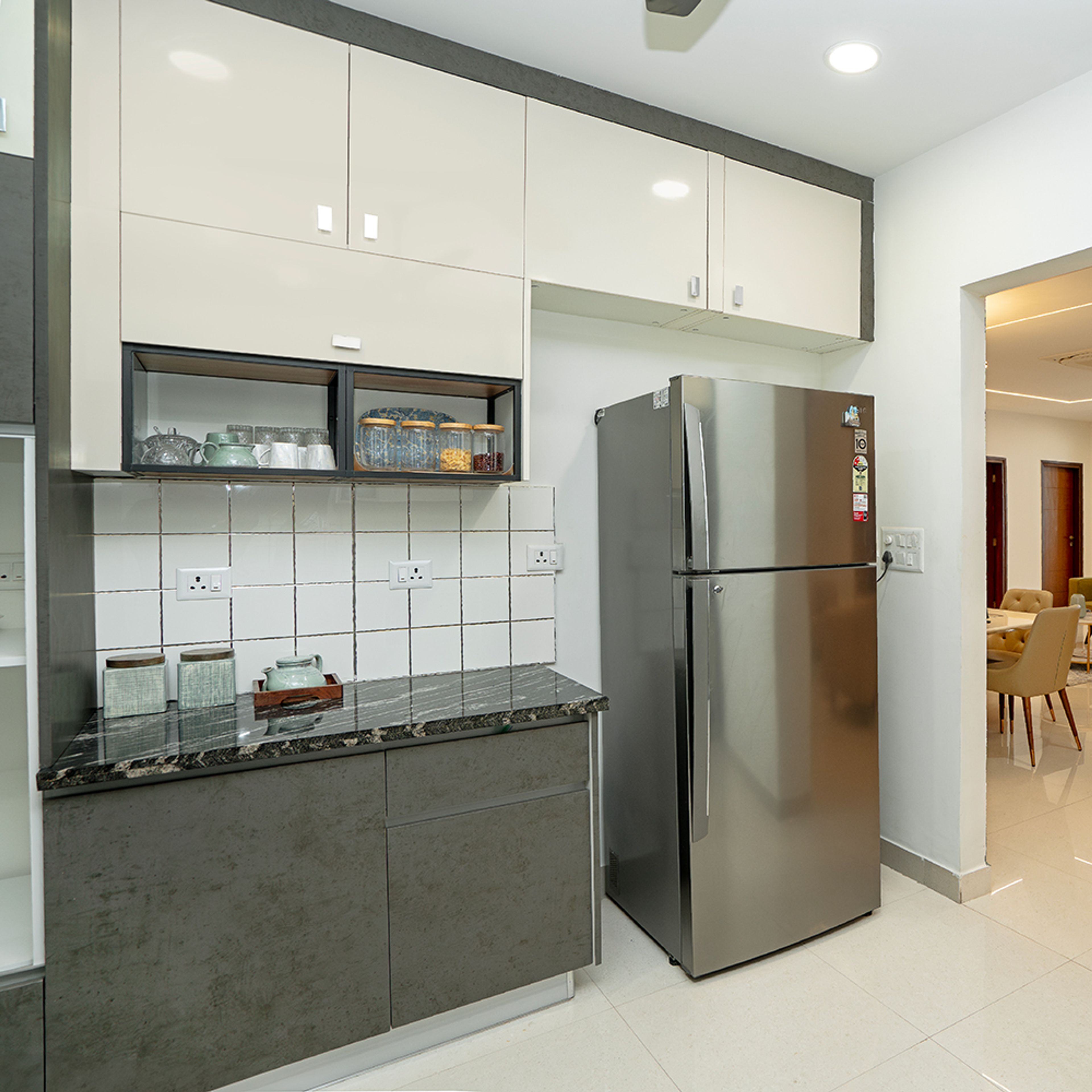 U-Shaped Kitchen Design with Blacks and White Square Tiles Backsplash and Grey Textured Cabinets
