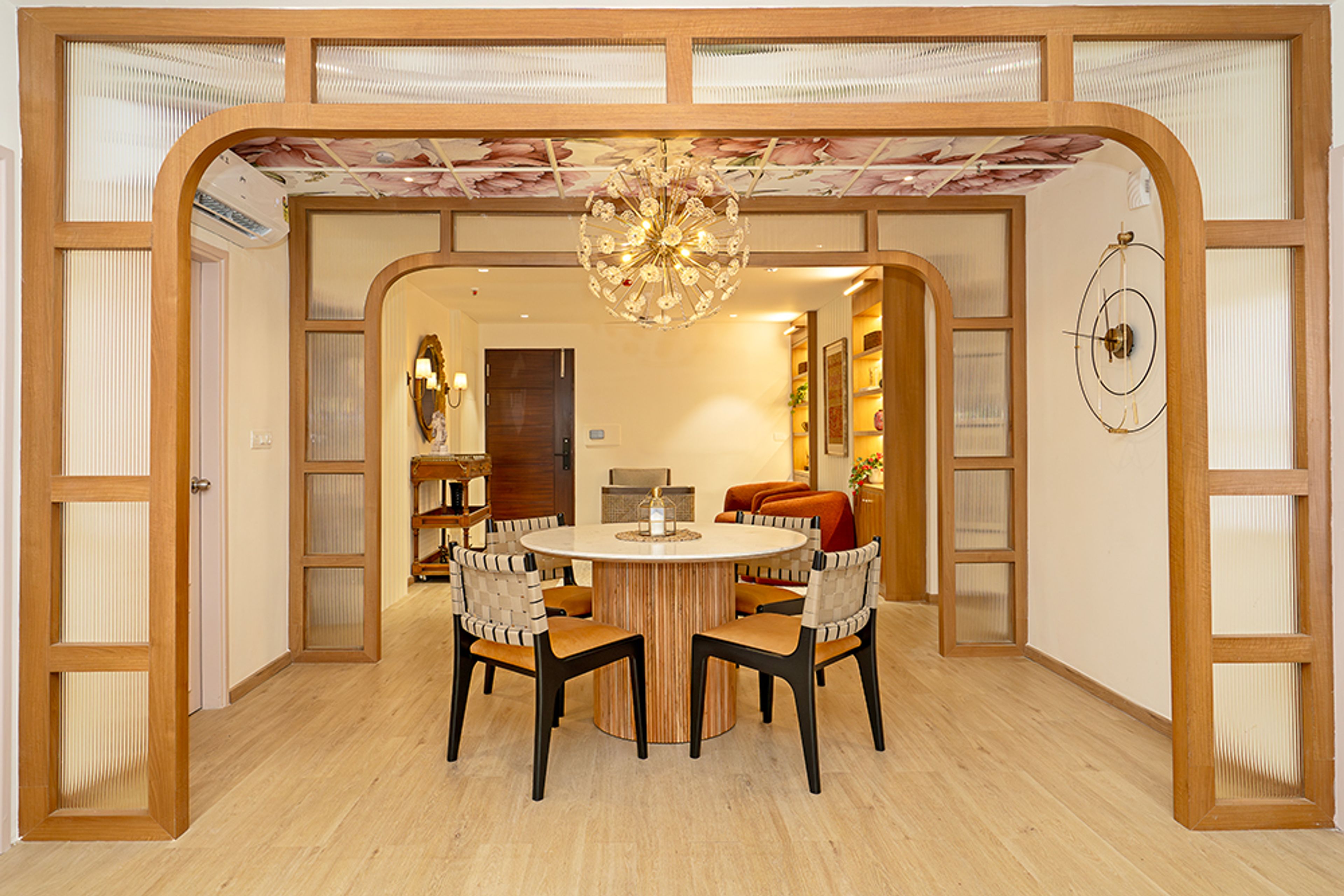 Dining Room With Wooden Arched Accents, Floral Ceiling and 4-Seater Dining Table