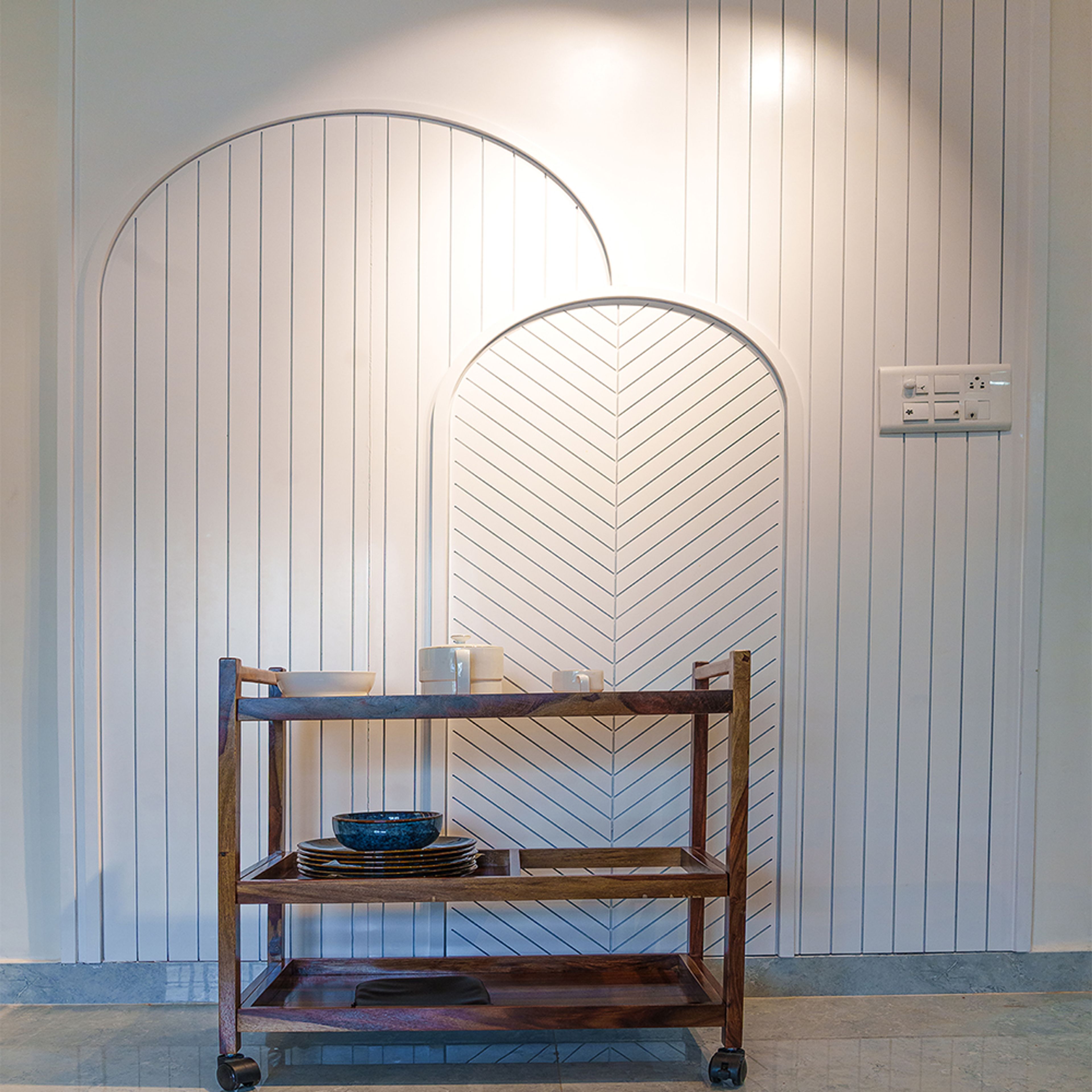 White Arched Wall Design with Geometric Patterns