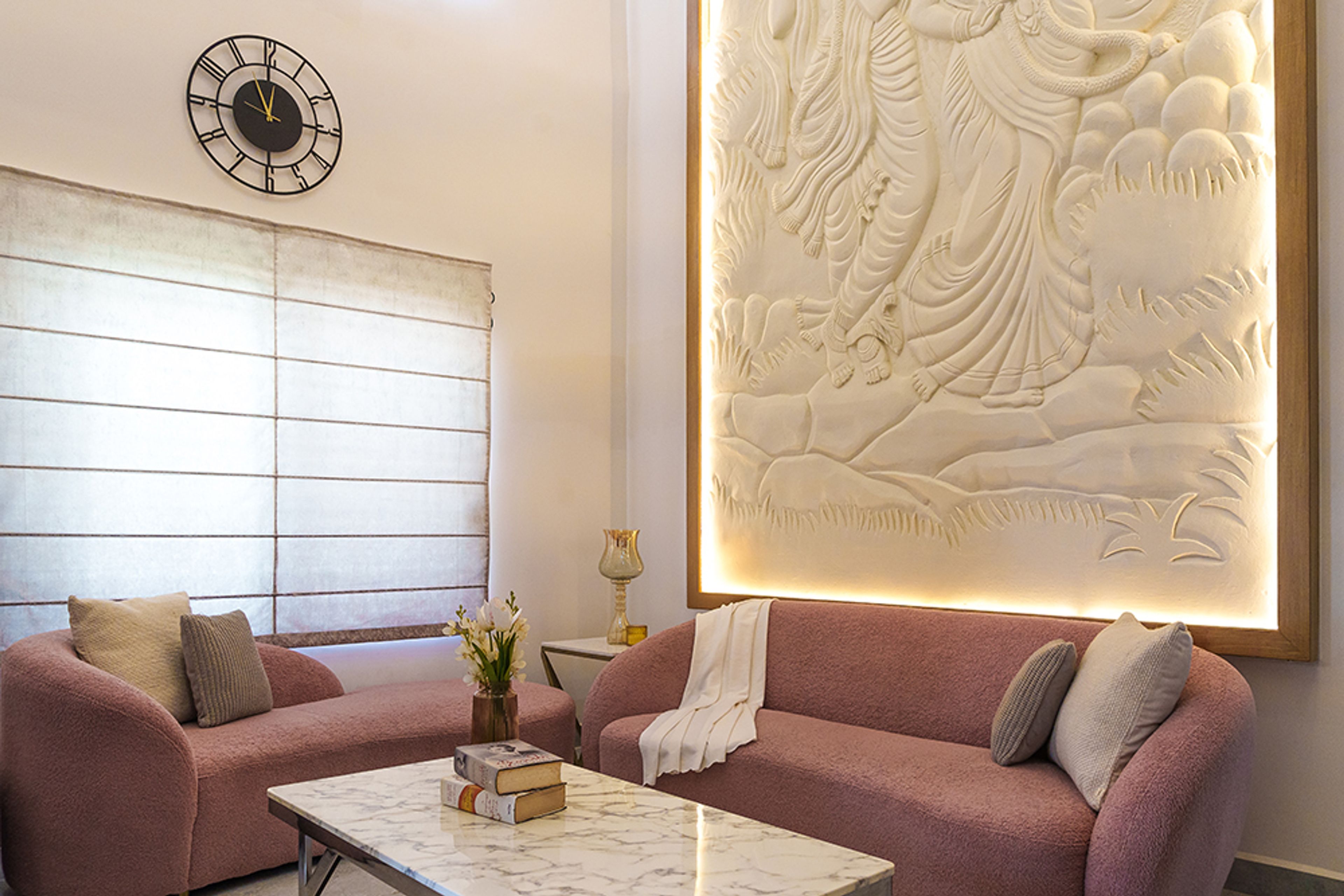 Living Room Design with Backlit Artistic Wall Mural, Roman Blinds, and Blush Pink Sofas