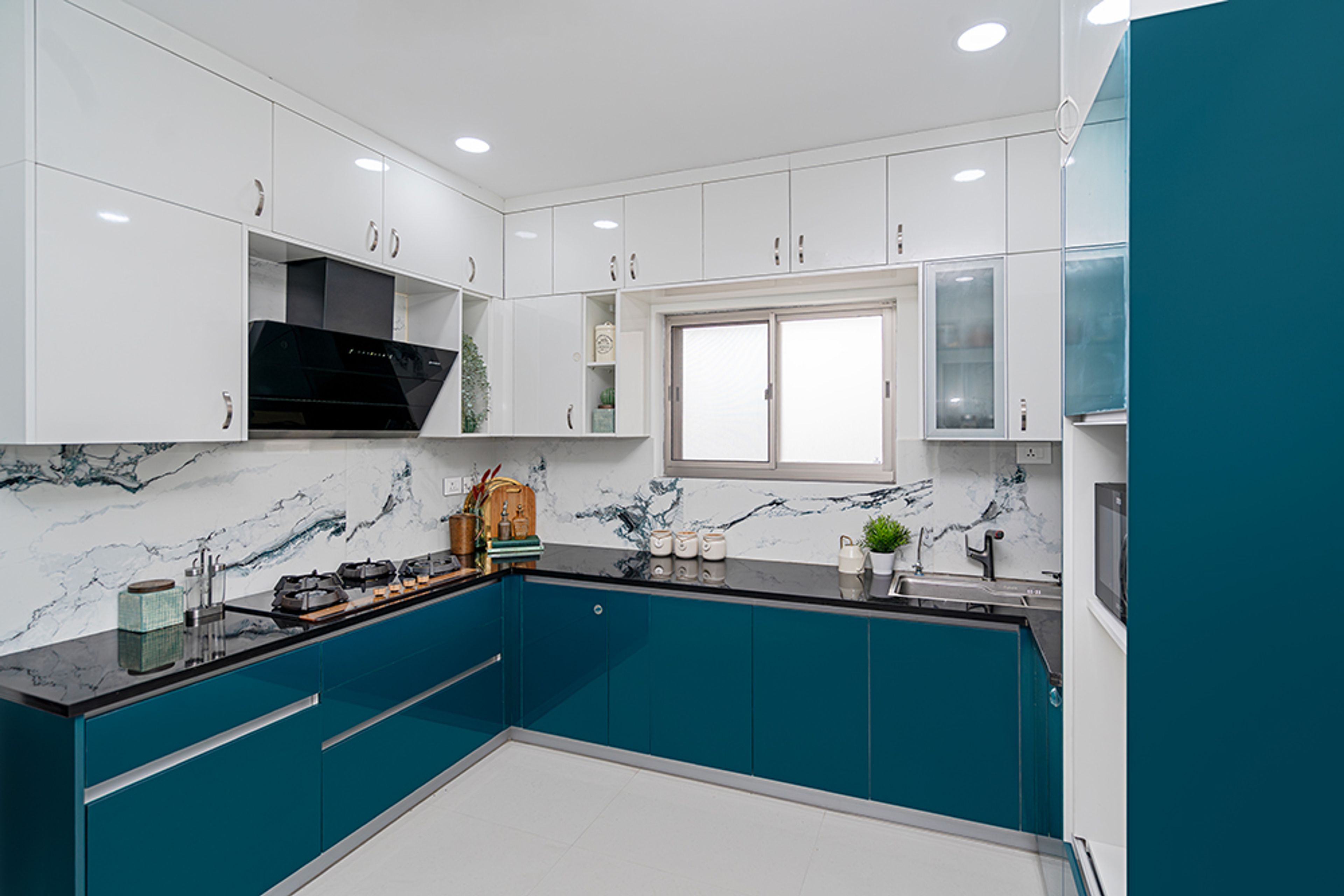 U-Shaped Kitchen Design with Blue and White Cabinets