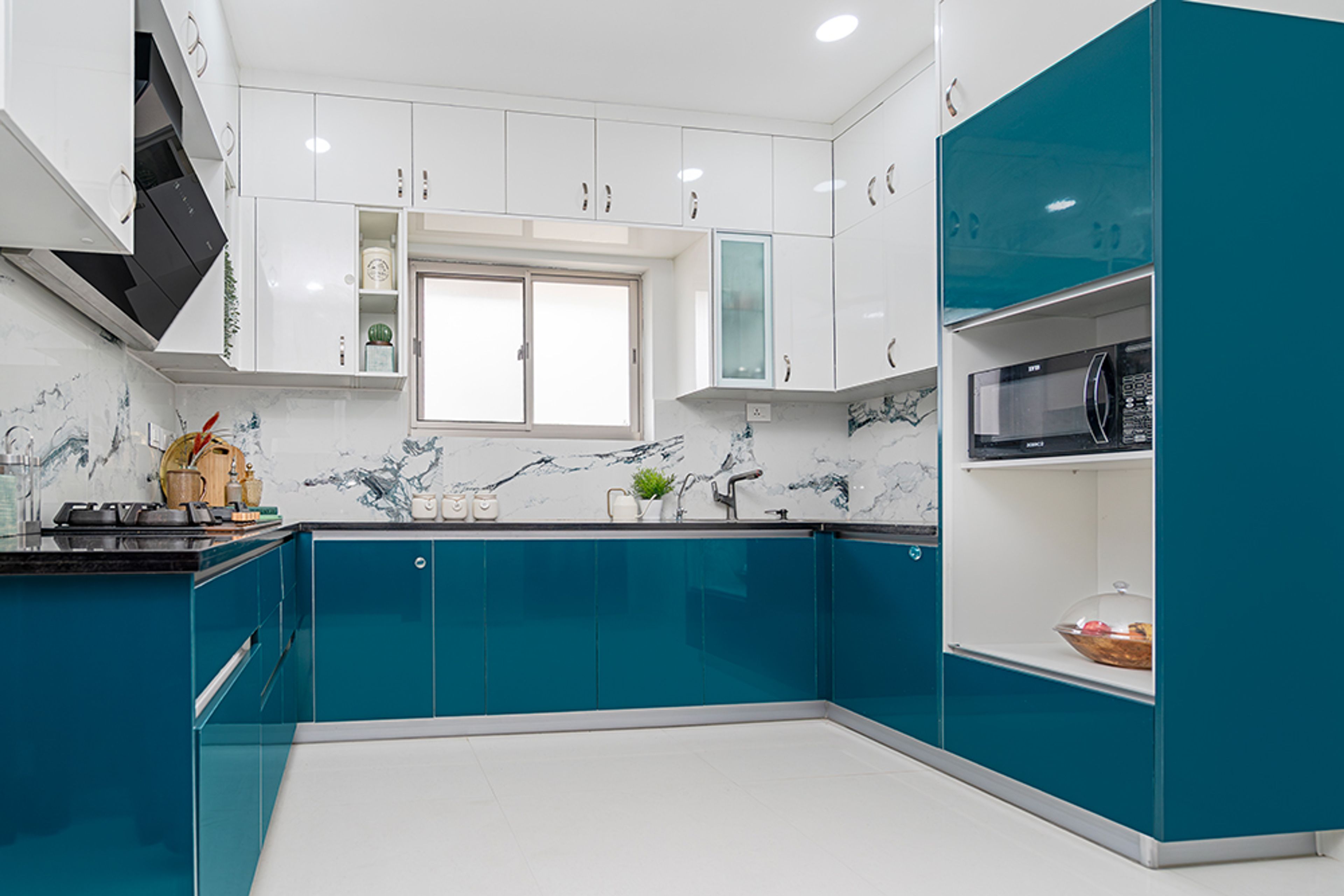 U-Shaped Kitchen Design with Marble Patterned Backsplash Wall and Granite Countertop