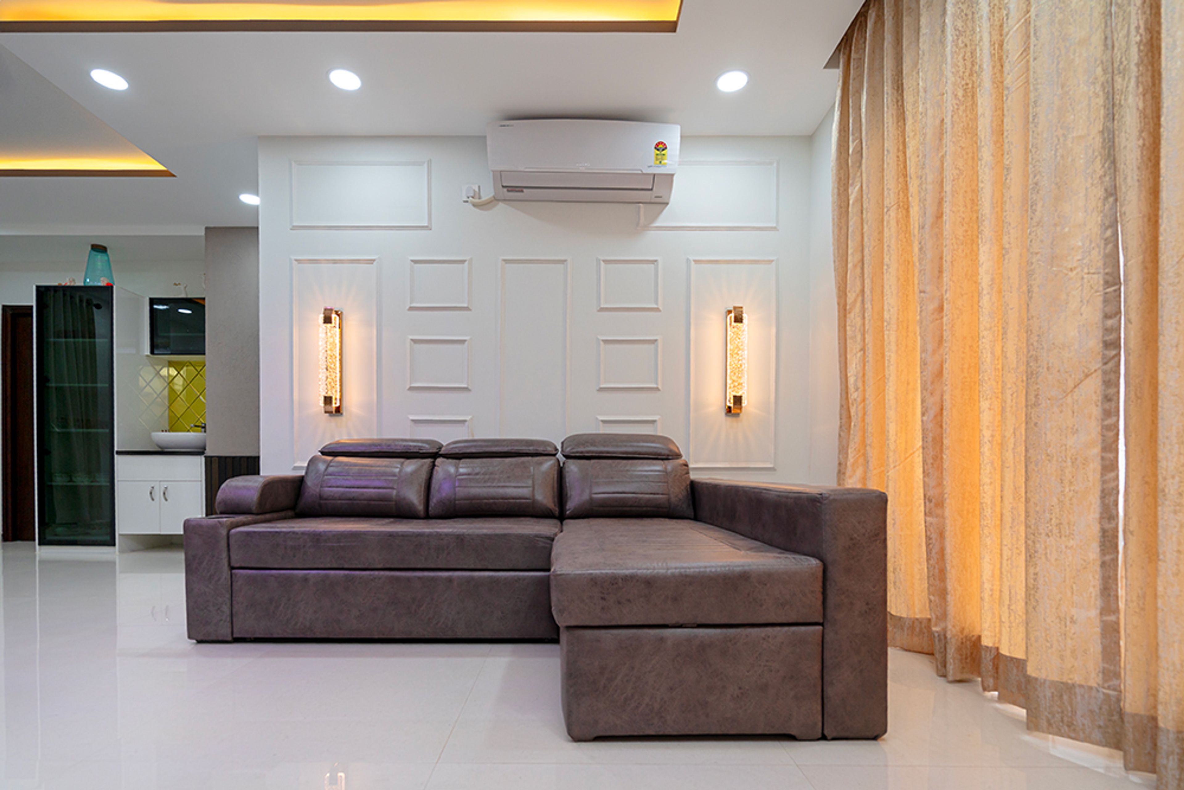 Living Room Design with Grey Leather L-Shaped Sofa and White Wall with Trims