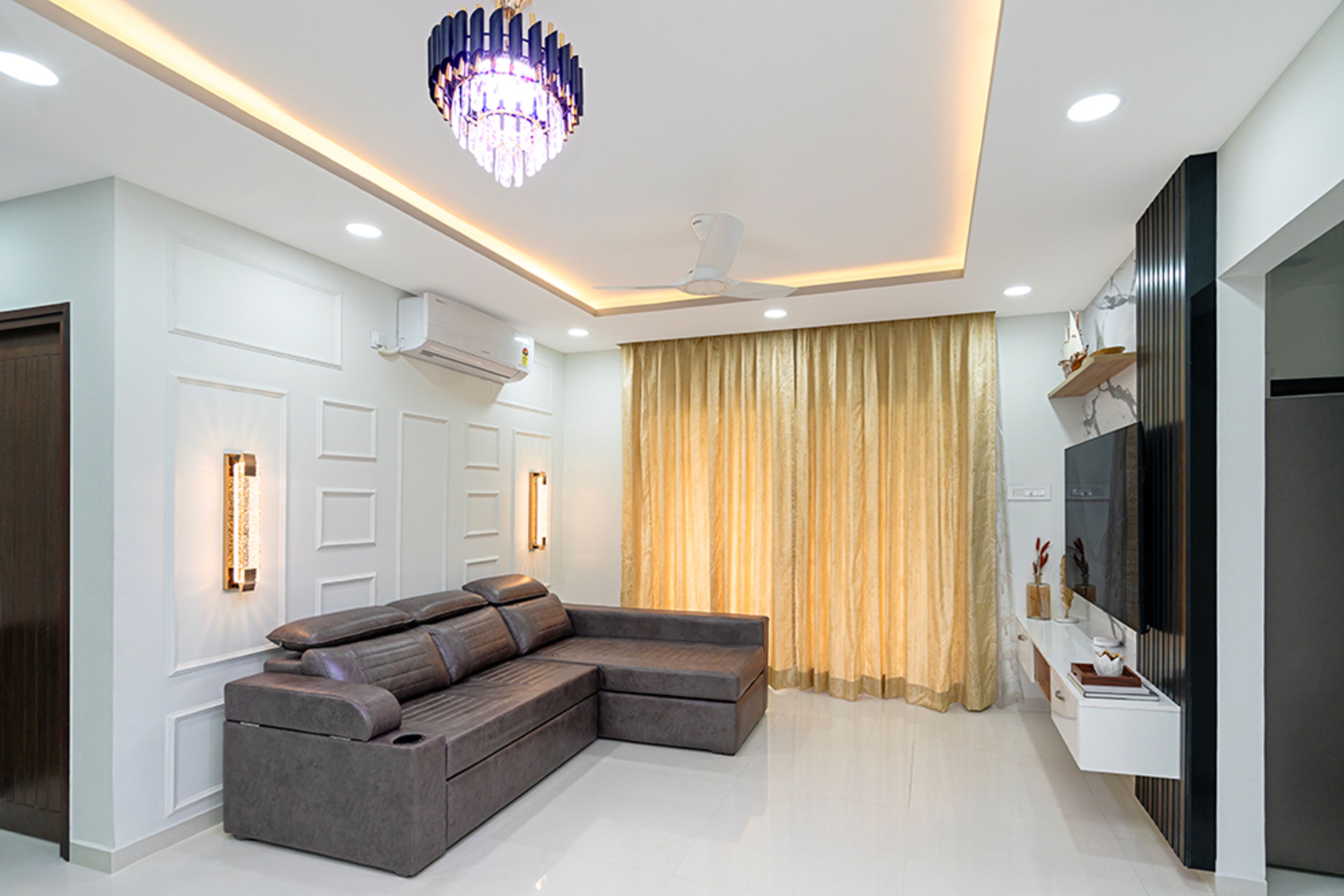Living Room Design with Grey Leather L-Shaped Sofa, TV Unit and White Wall with Trims