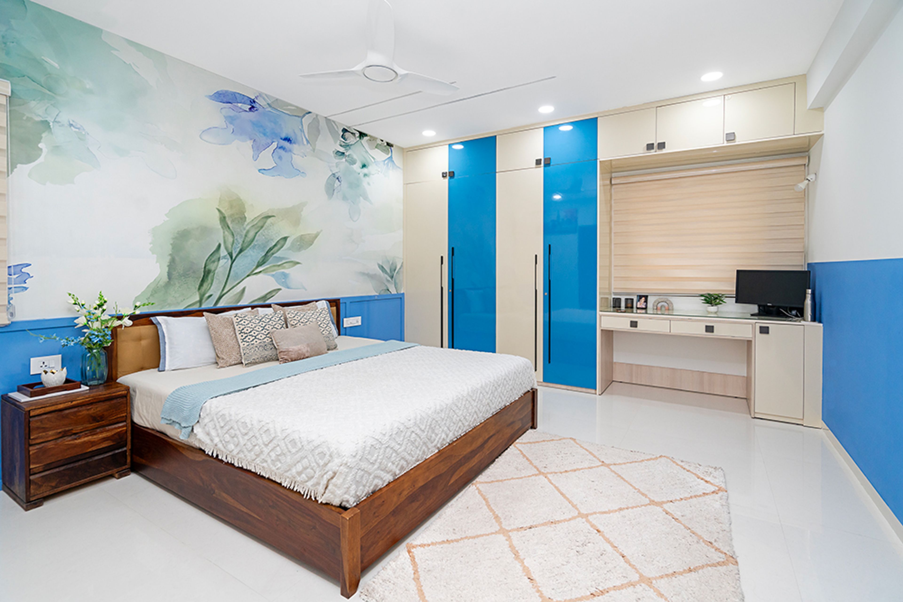 Bedroom Design with Blue Floral Wallpaper and 4-Door Blue and Cream Swing Wardrobe