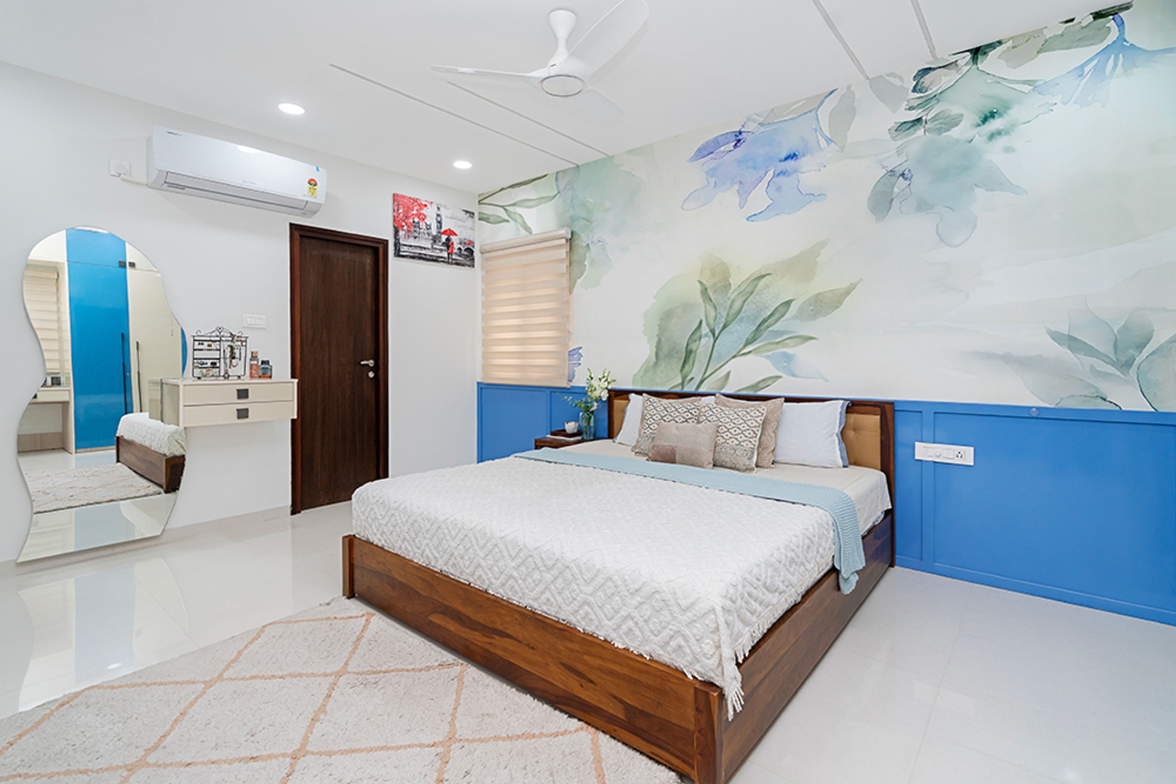 Bedroom Design with Blue Floral Wallpaper and Assymetrical Wall Mirror