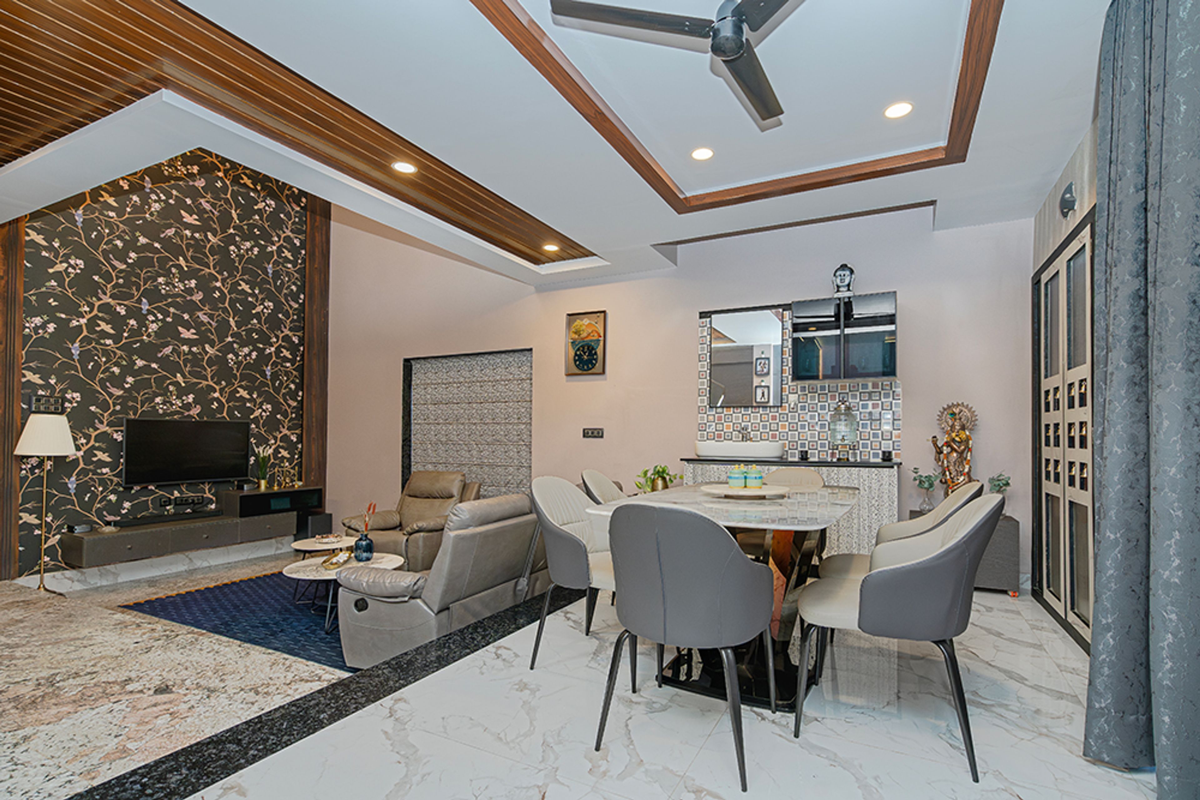 Living Room With Textured Wallpaper, Geometric False Ceiling and 6-Seater Dining Table