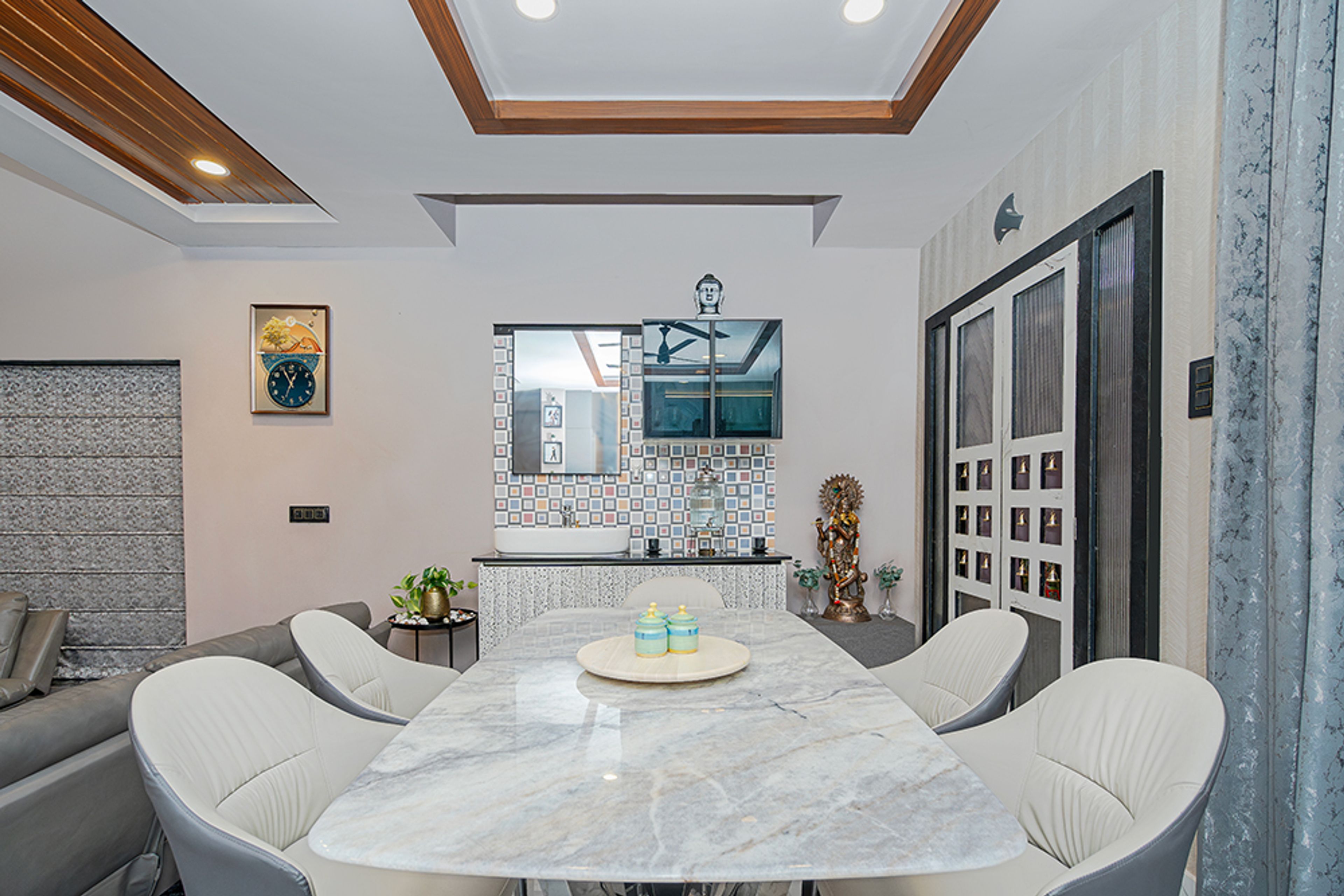 6-Seater Dining Room Design with White and Grey Chairs and Marble Top Table