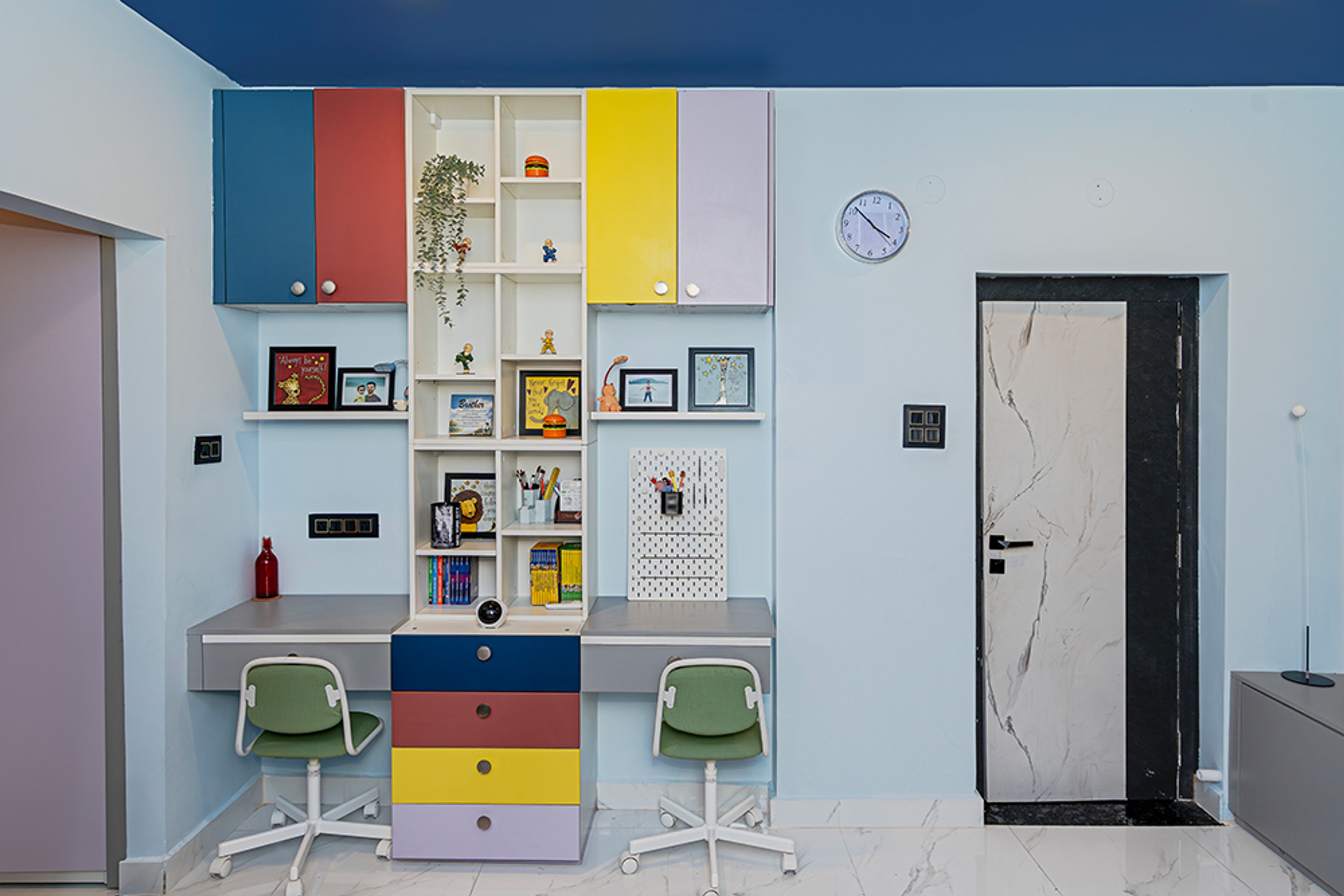 Kids Bedroom Design with Dual Study Desk with Wall Shelves and Green Chairs
