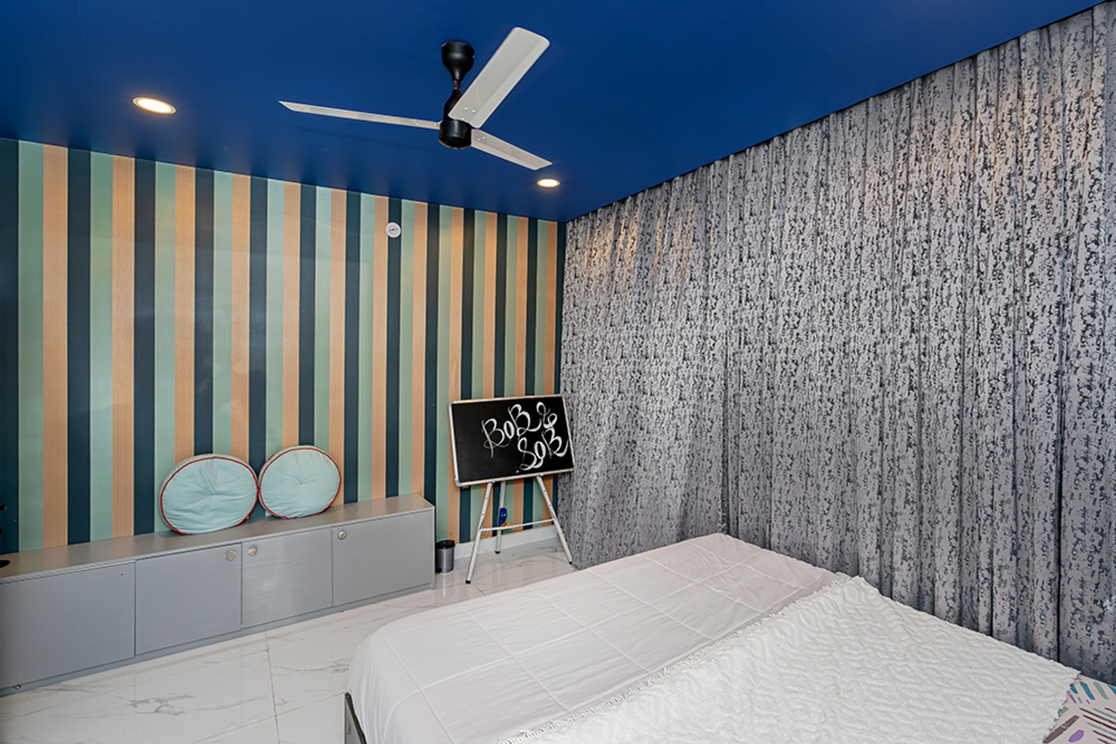 Kids Bedroom Design with Striped Green and Yellow Wallpaper and Grey Storage Bench