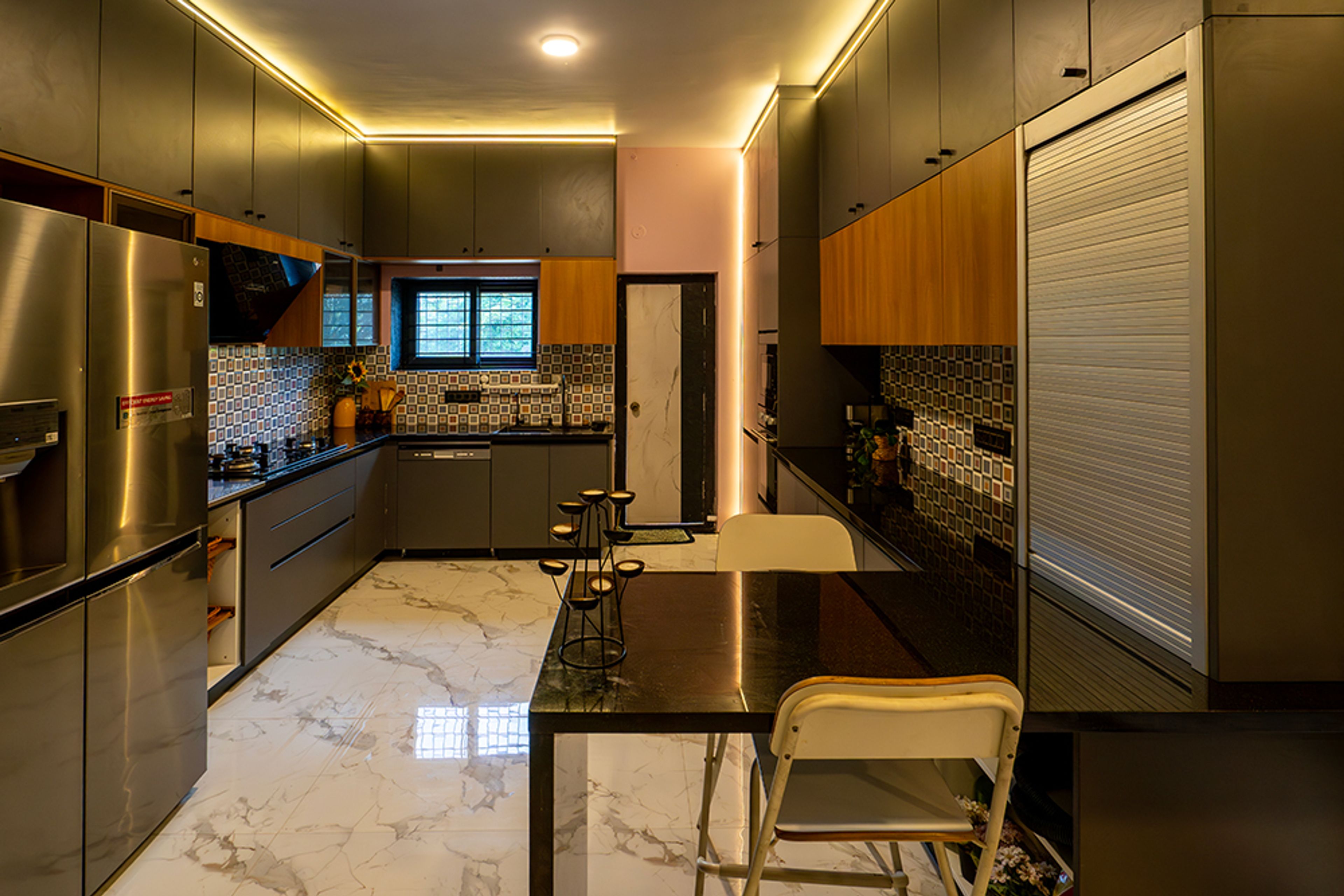 U-Shaped Kitchen Design with Cove Lit Grey and Natural Wood Units and Patterned Backsplash Tiles