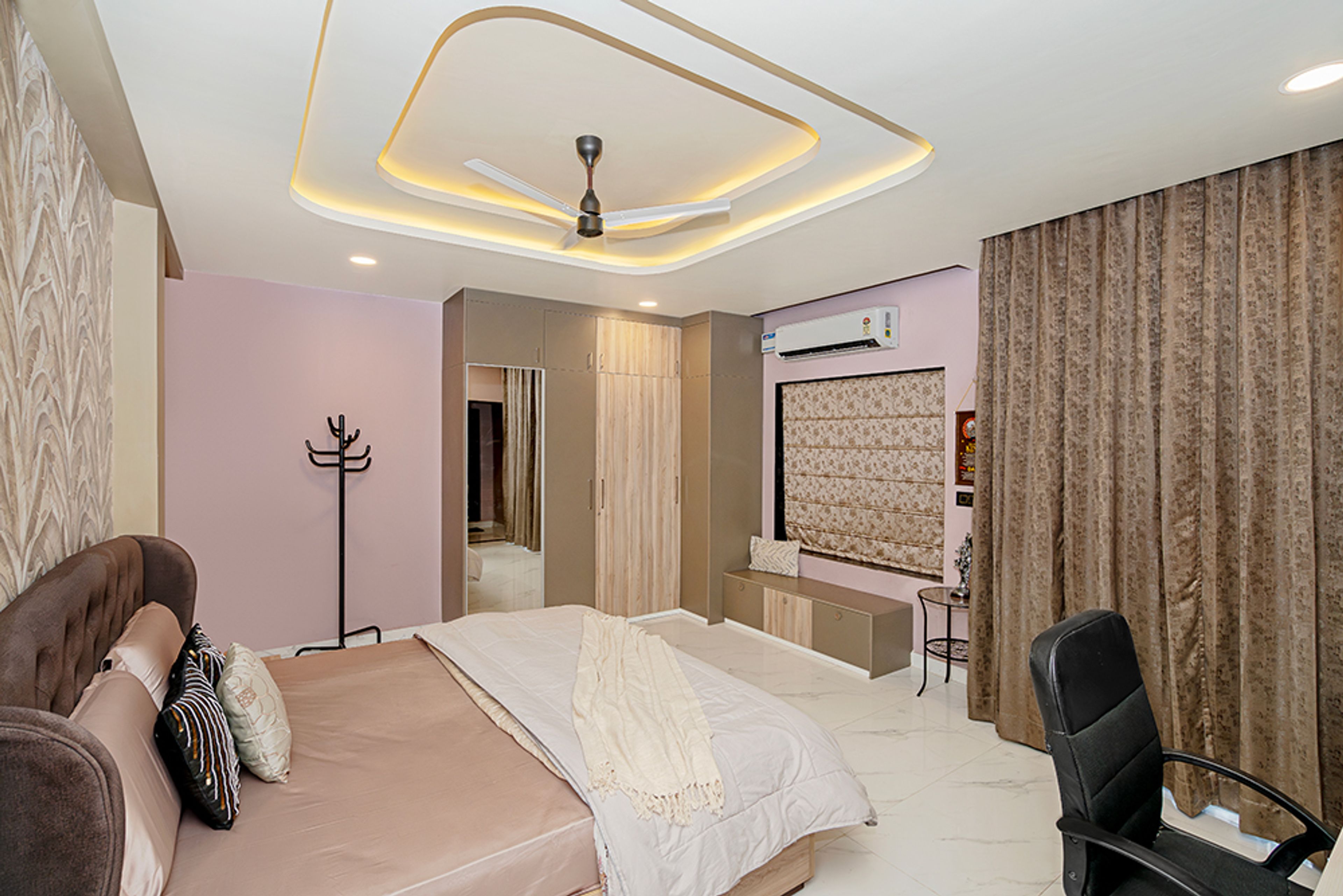Bedroom Design with Geometric Gypsum False Ceiling and Pink Walls