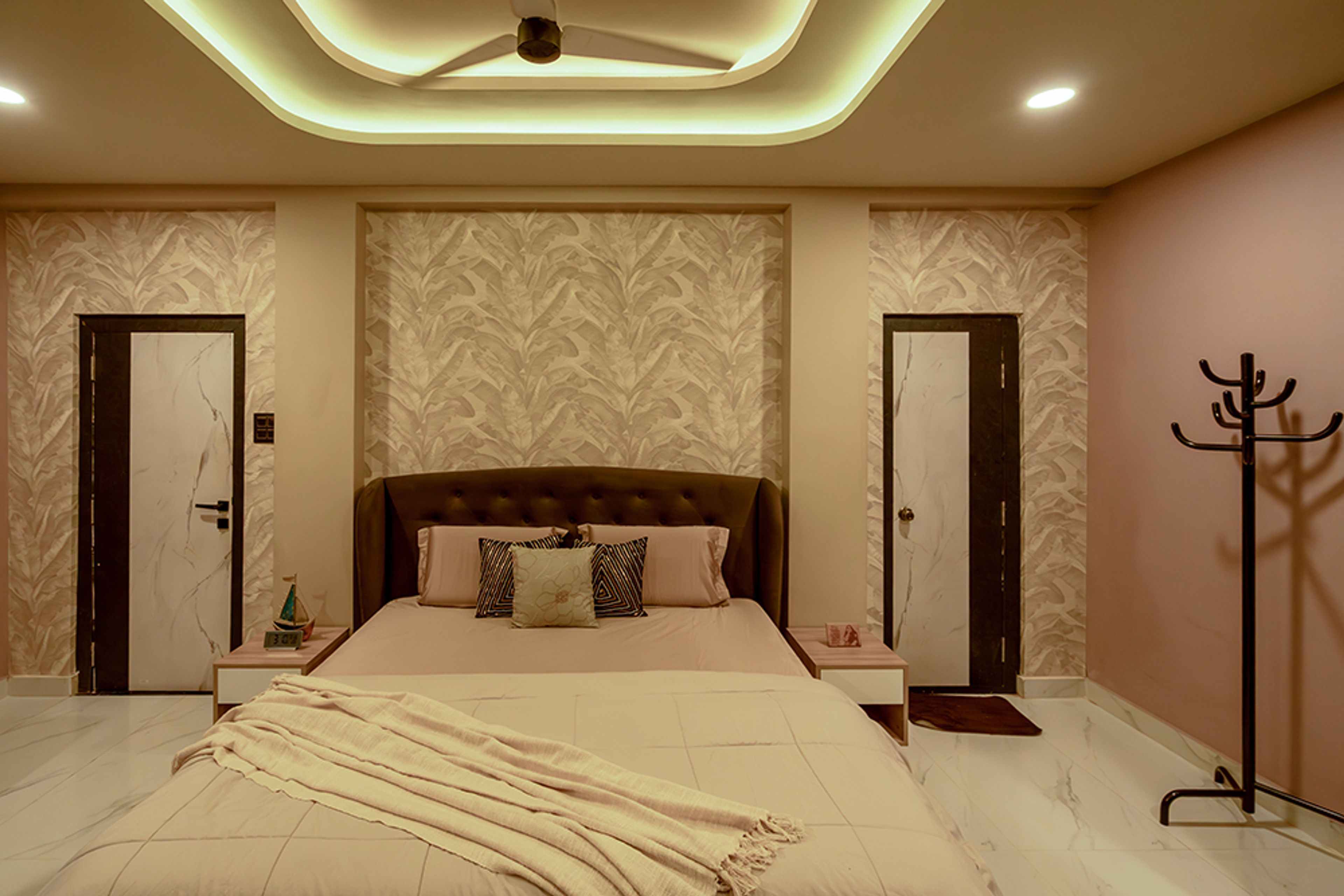 Bedroom Design with Tropical Themed Cream Wall and Brown Tufted Headboard Bed