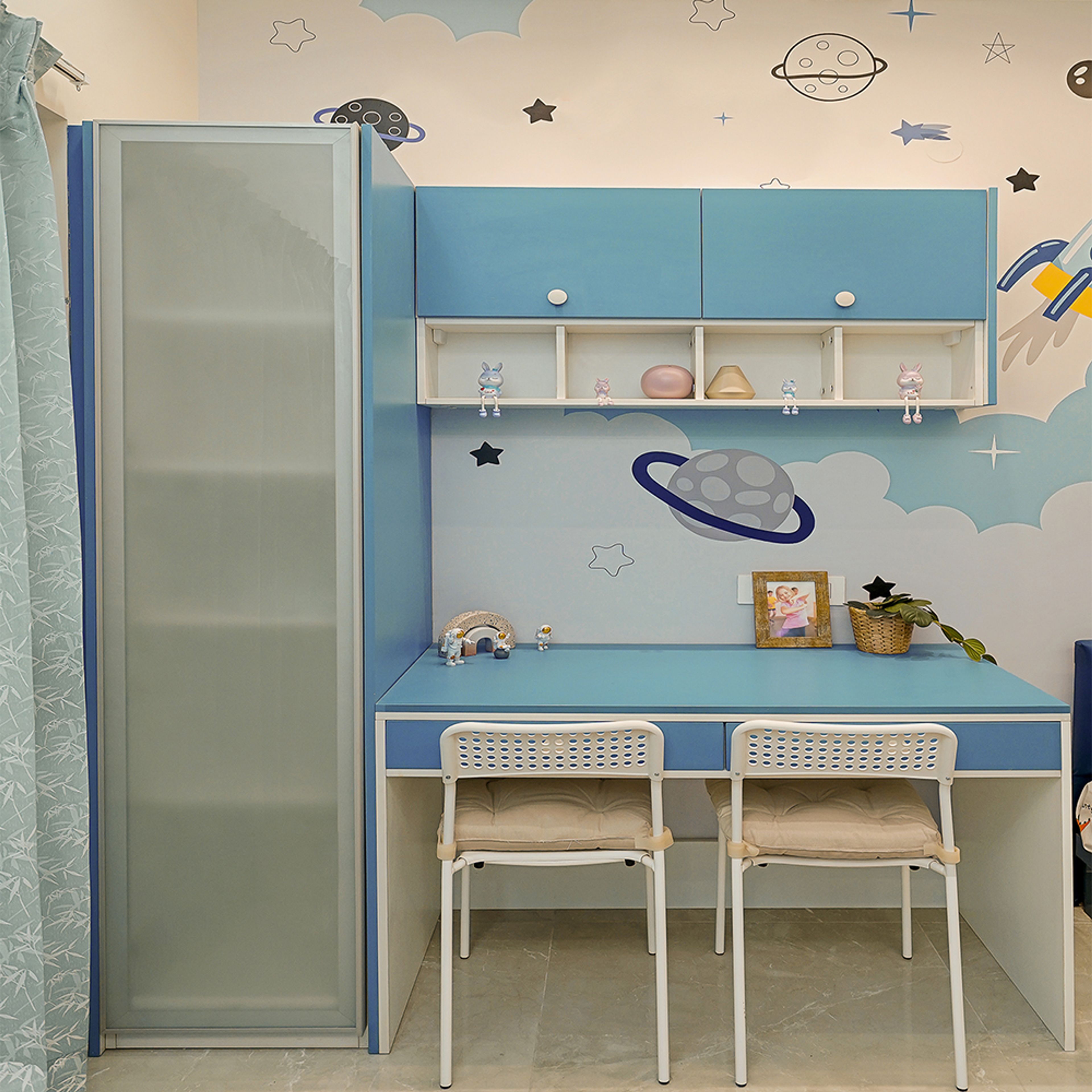 Kids Bedroom With Light Blue Study Desk with Two Chairs and a Tall Unit