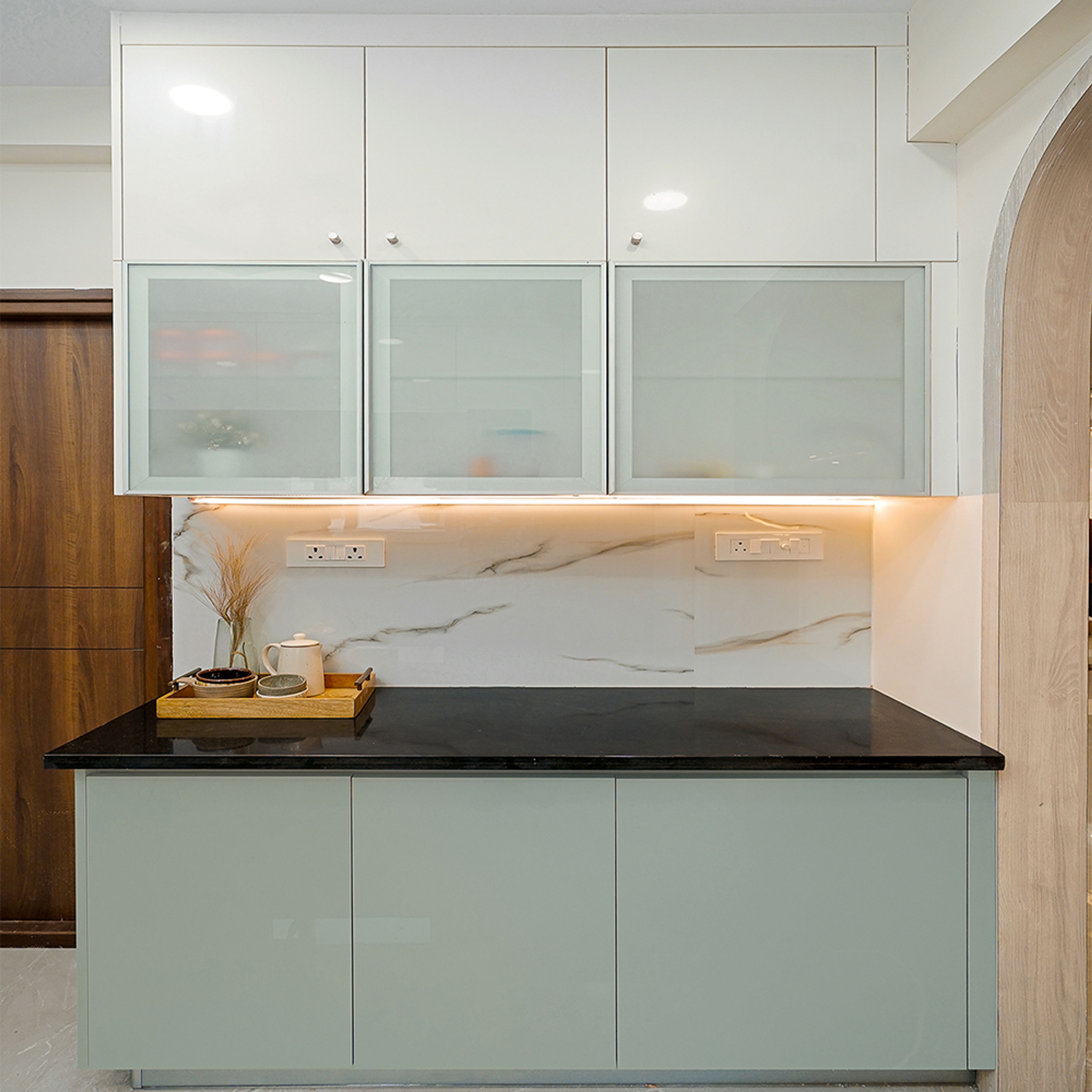 L-Shaped Kitchen Design with Under Cabinet Lighting and Granite Countertop
