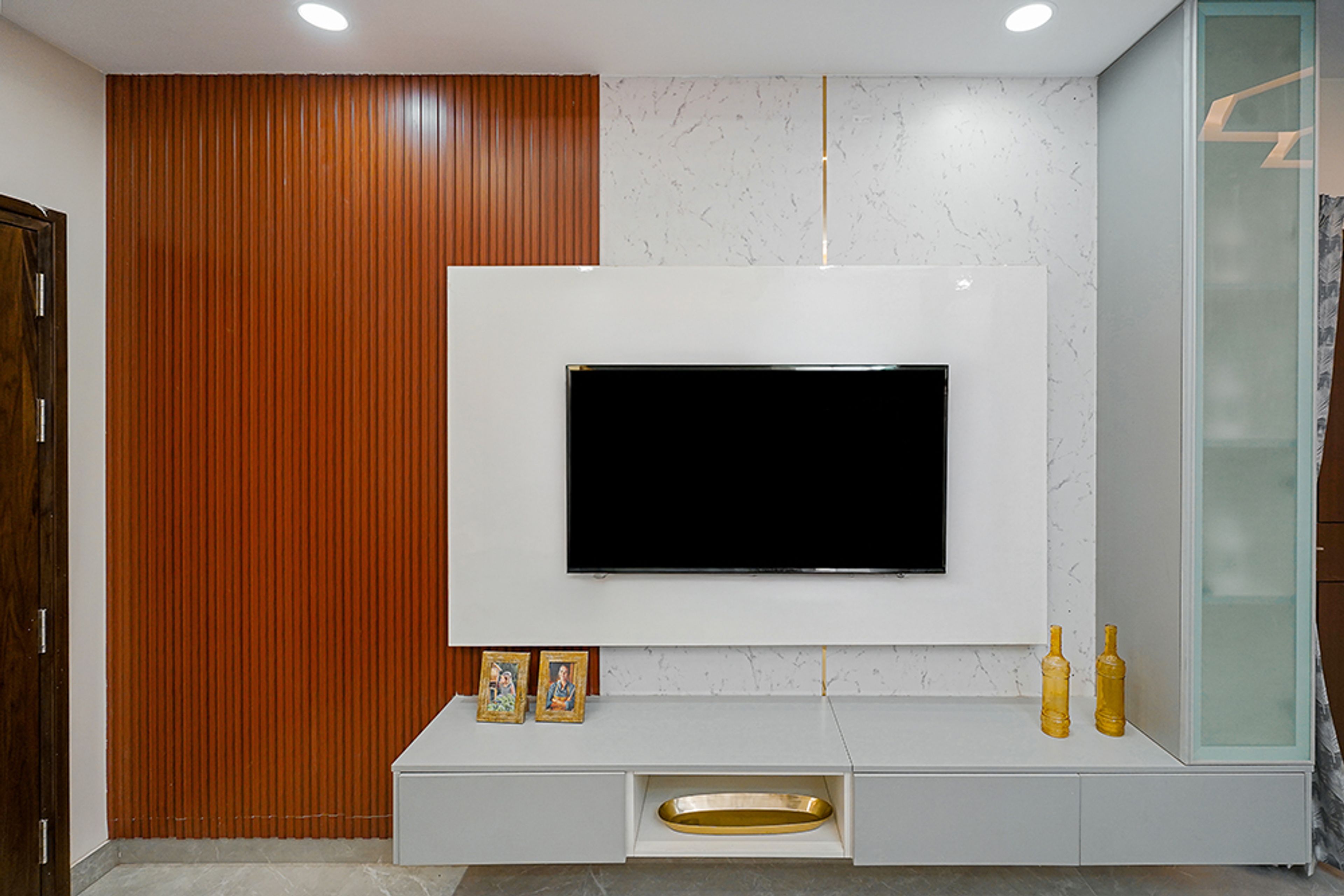 White TV Unit Design with Brown Fluted Wall Panels