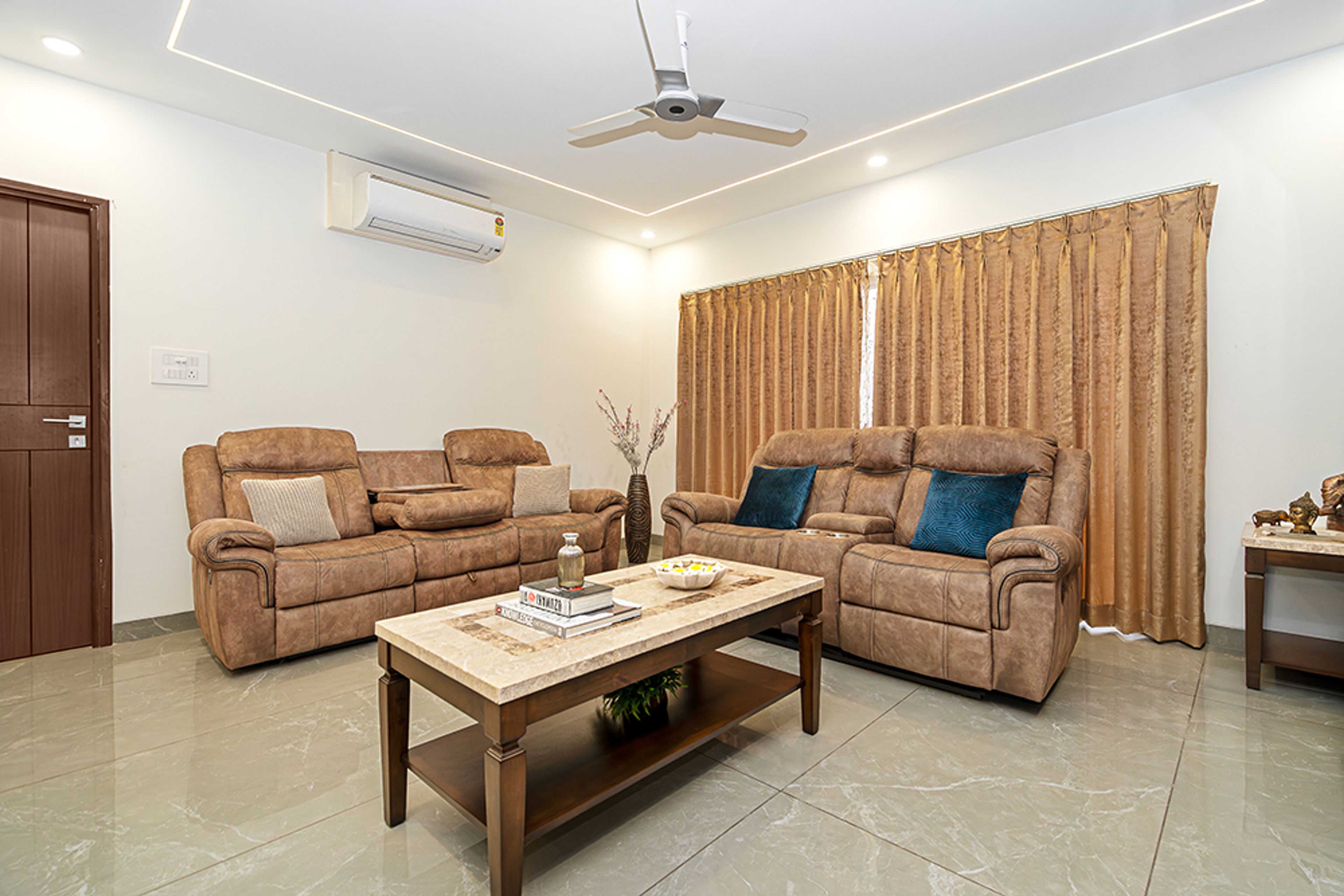 Modern Living Design with Brown Leather Sofas in Hyderabad 3BHK Apartment