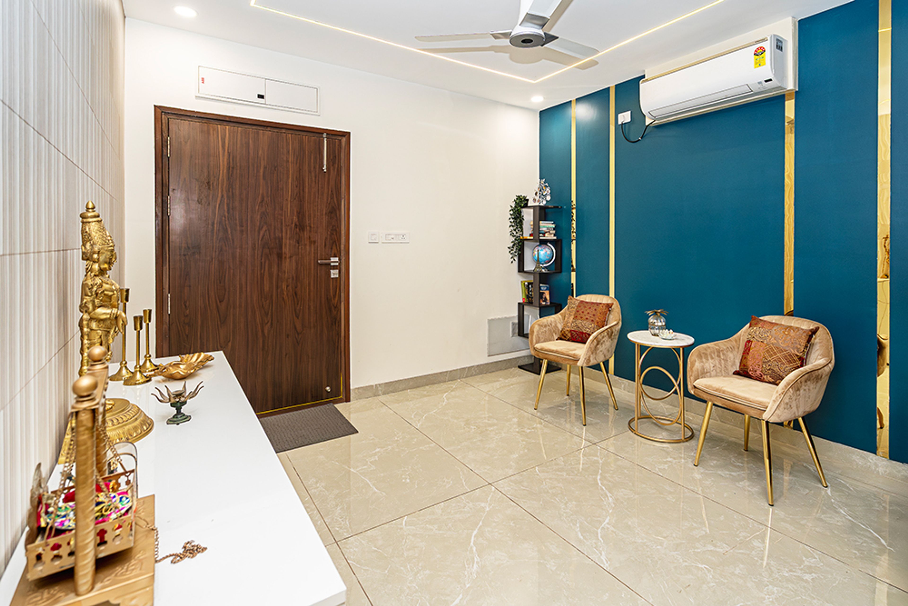 Modern Pooja Design with Two Chairs in Hyderabad 3BHK Apartment