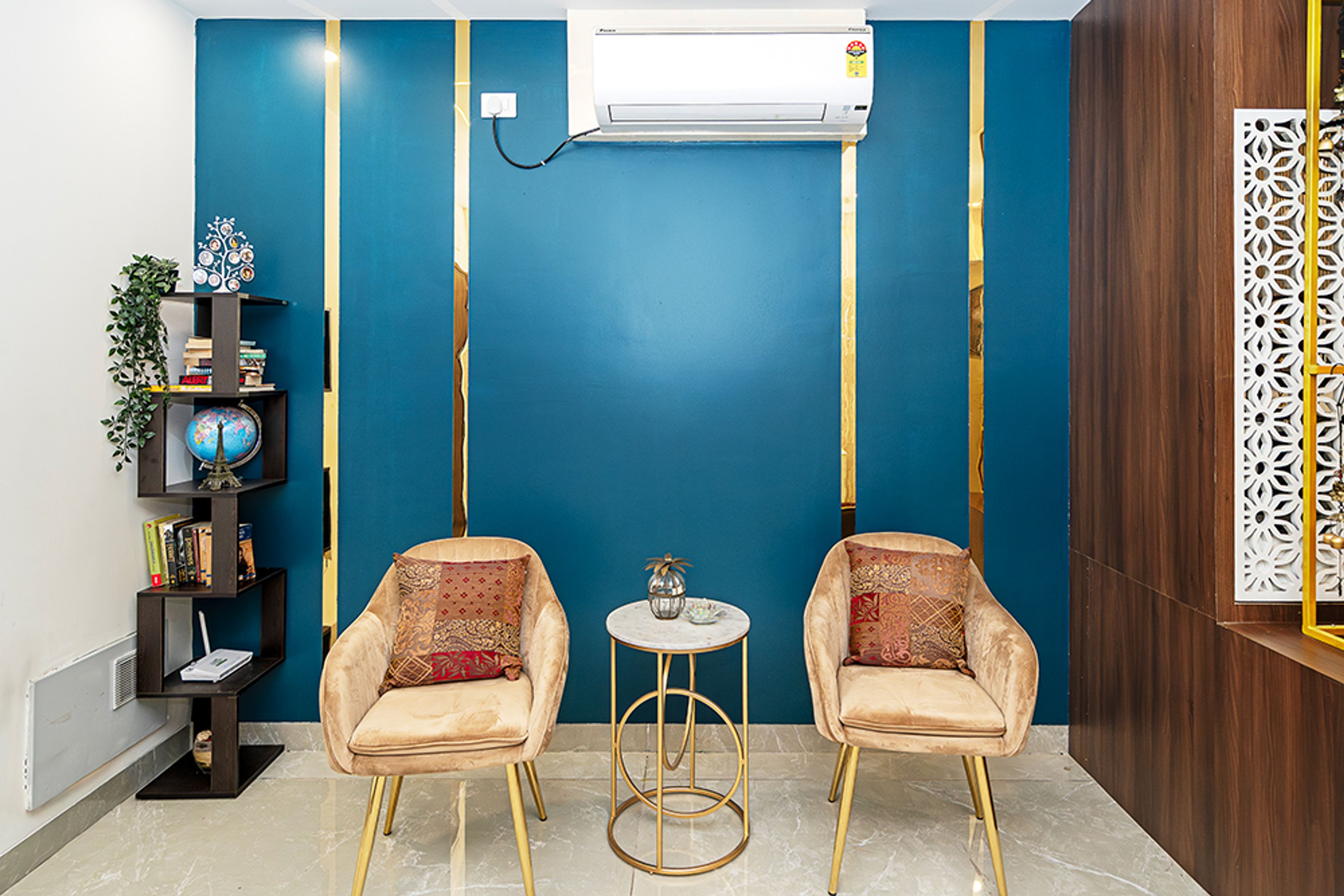 Modern Pooja Design with Two Chairs in Hyderabad 3BHK Apartment