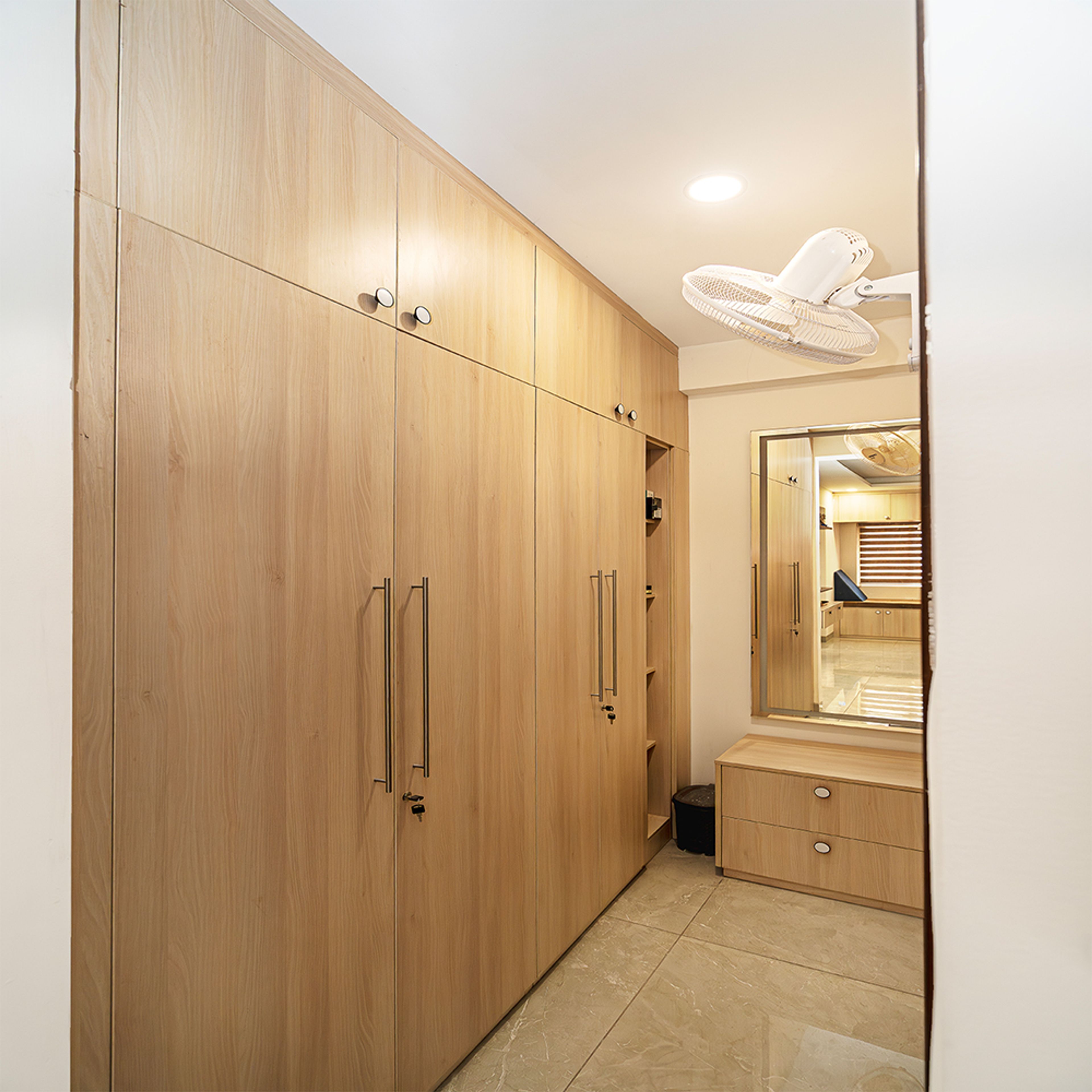 Modern Wooden Swing Wardrobe Design in Hyderabad 3BHK Apartment