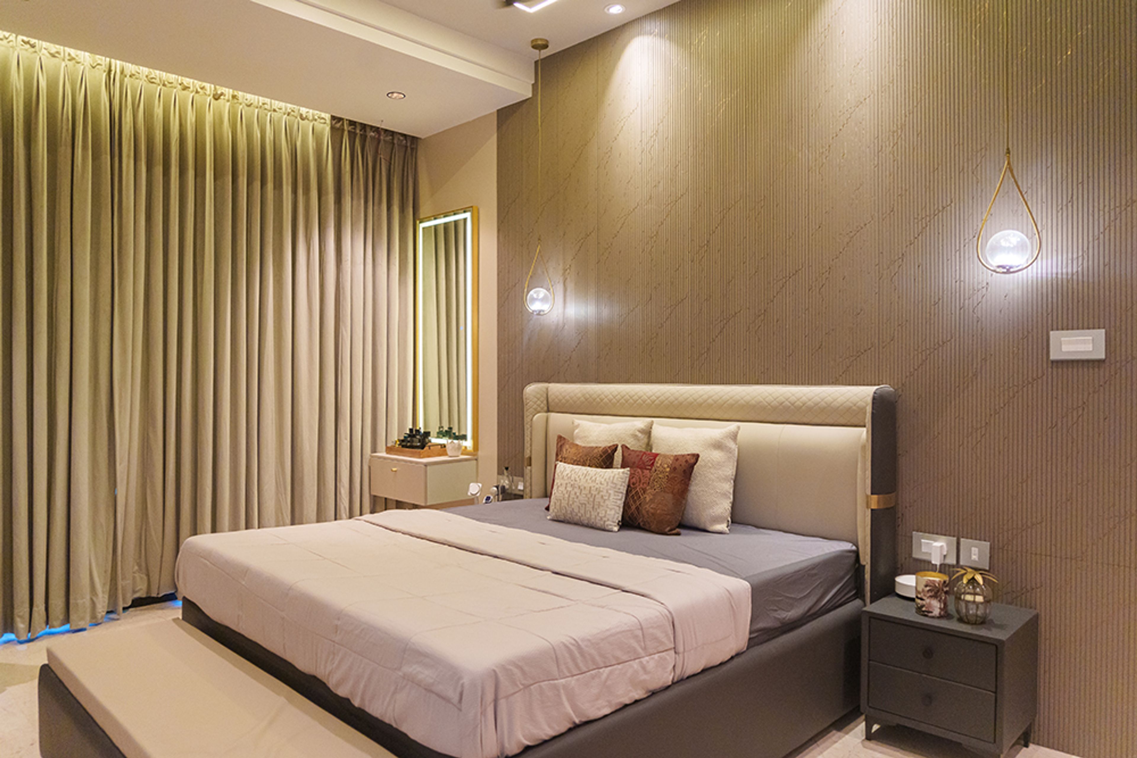 Bedroom Design with Brown Fluted Wall Panel Walls and Cove Lit Mirror Dressing Unit