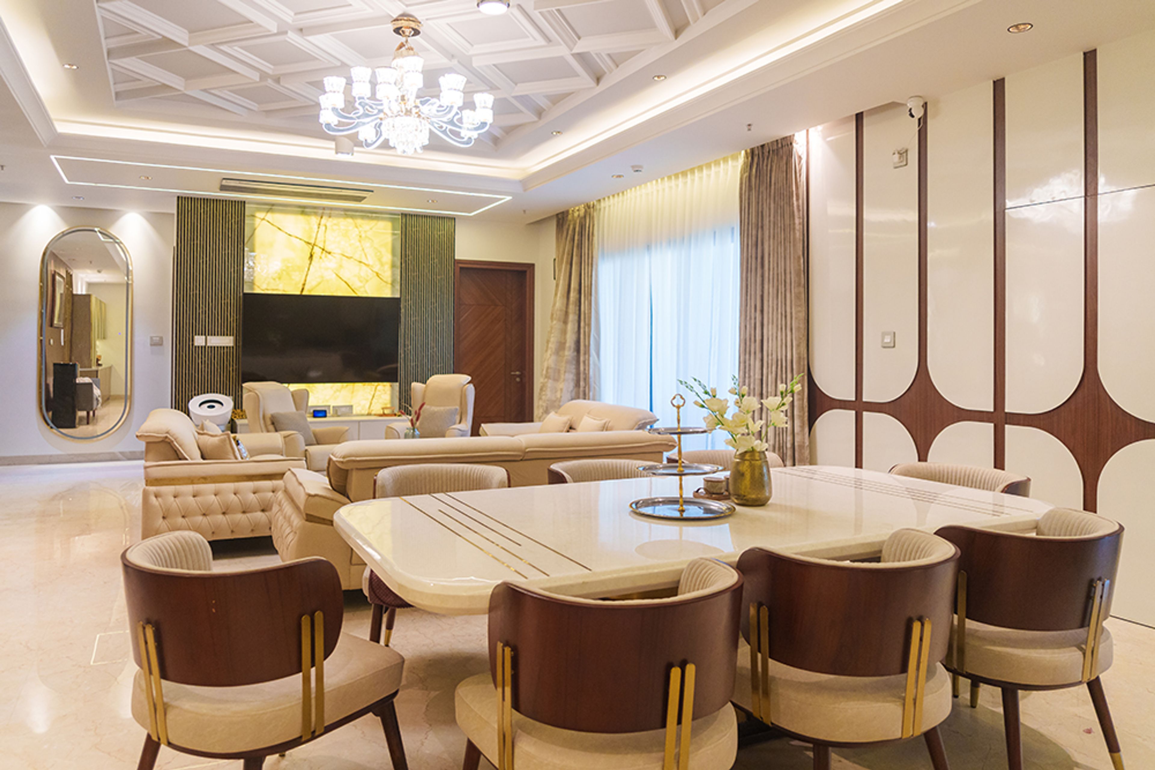 Living and Dining Room Design with Cream Upholstered Sofas, Marble Dining Table and 8 Beige Chairs