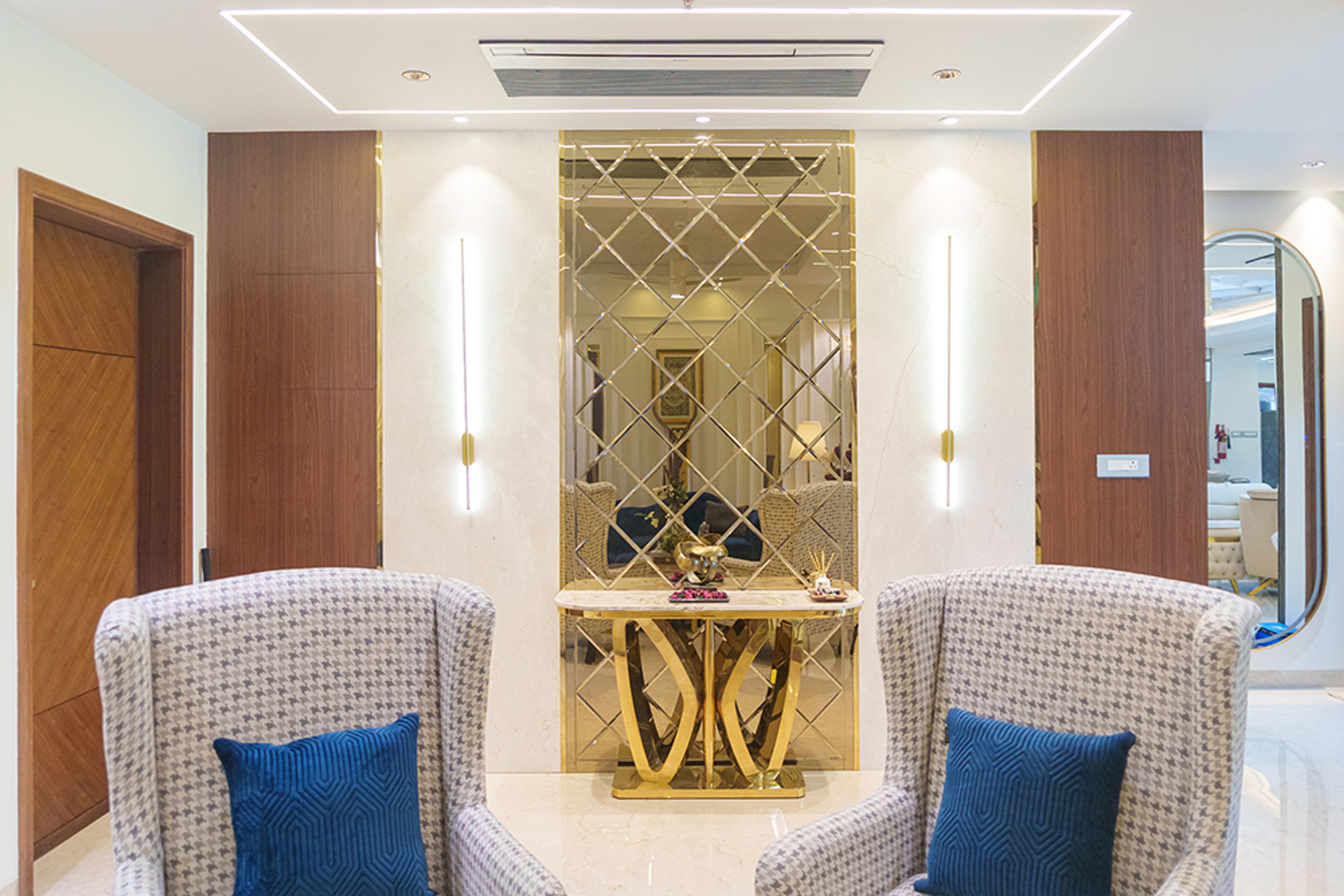 Foyer Design with Golden Mirror Geometric Wall