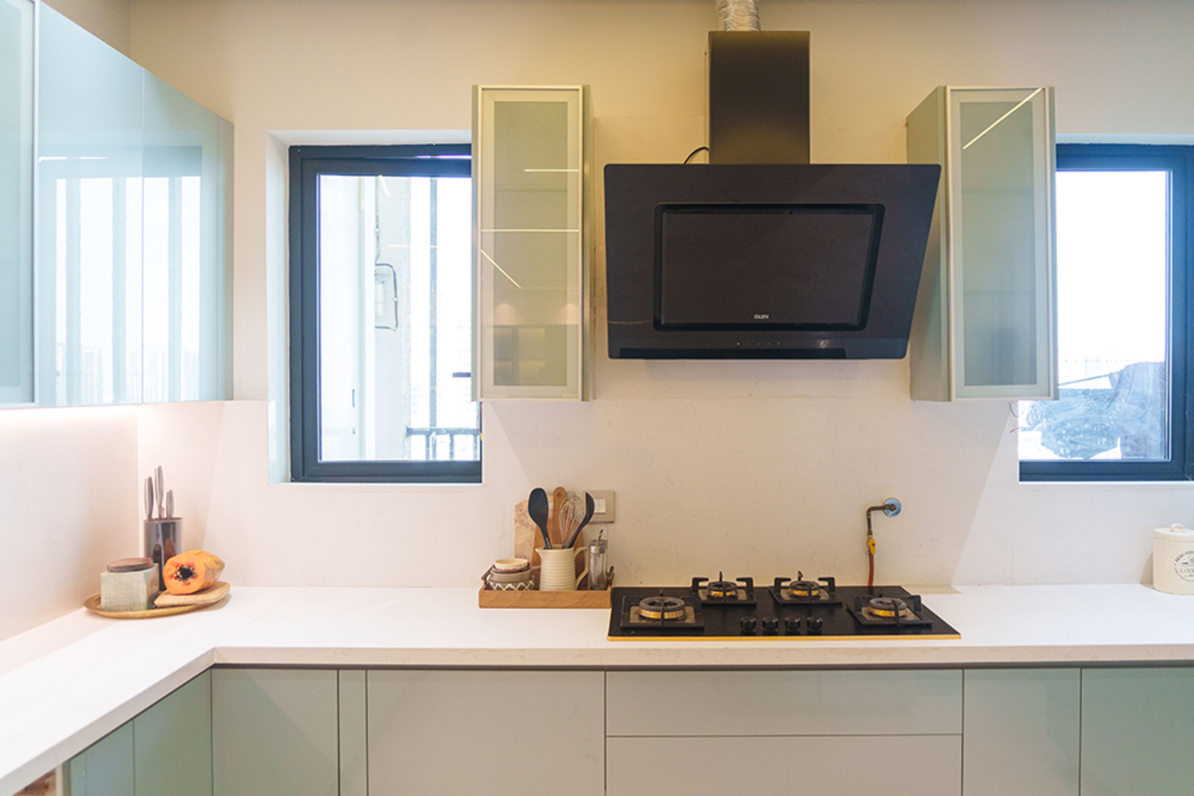 U-Shaped Kitchen Design with White Countertop and White Backsplash Wall