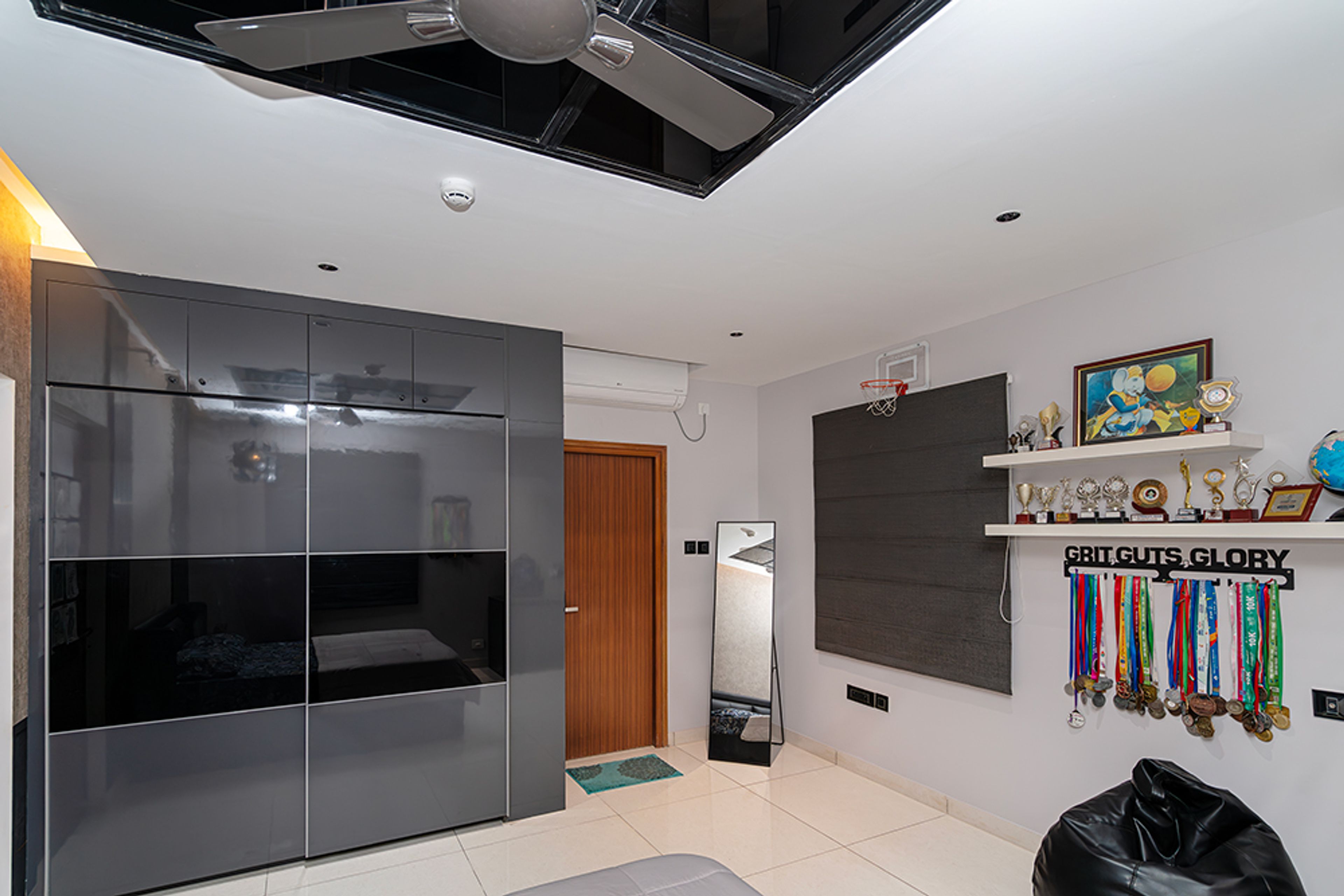 Bedroom Design with Grey and Black 2-Door Sliding Wardrobe and White Shelves