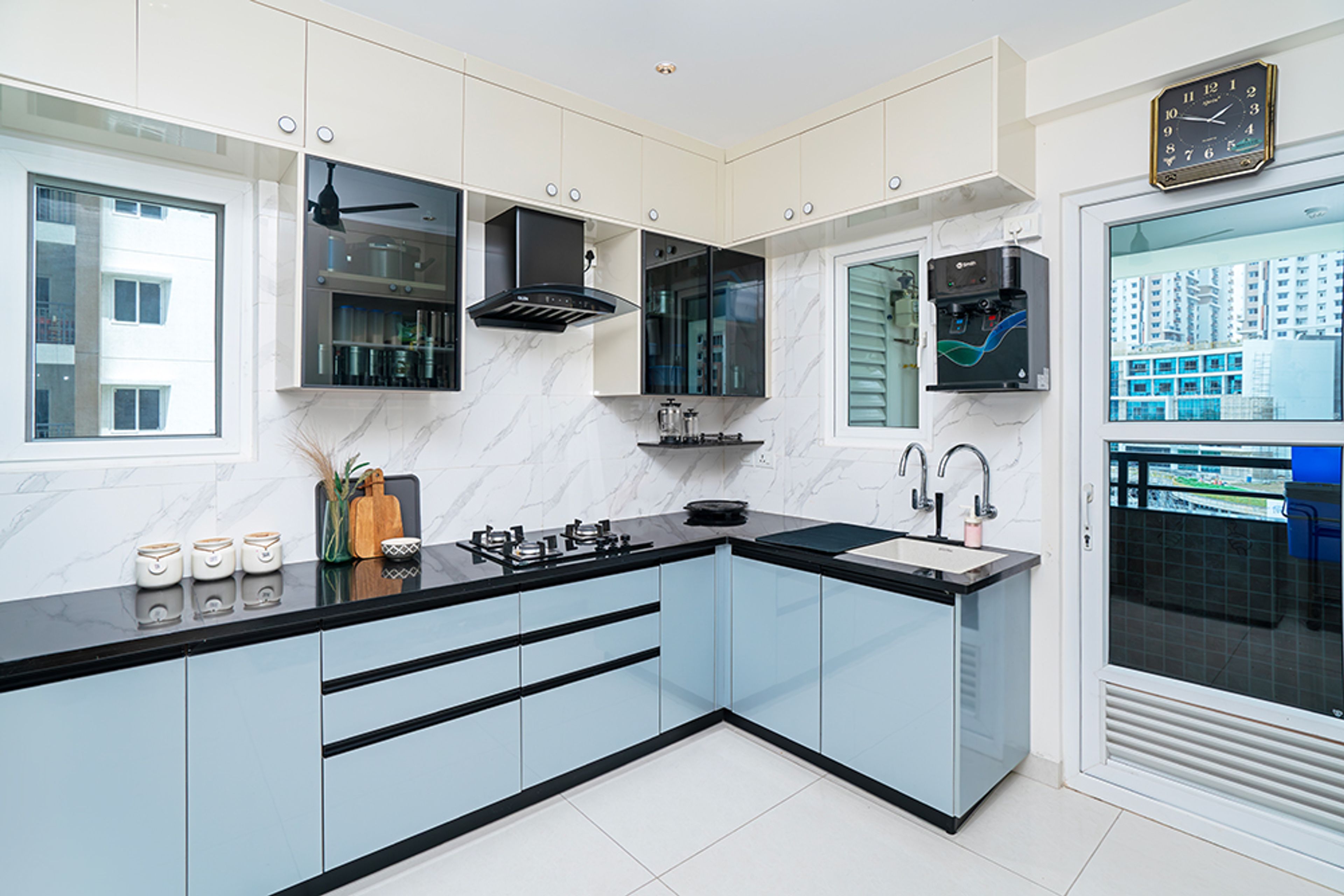 U-Shaped Kitchen Design with Blue Base and Cream Loft Units
