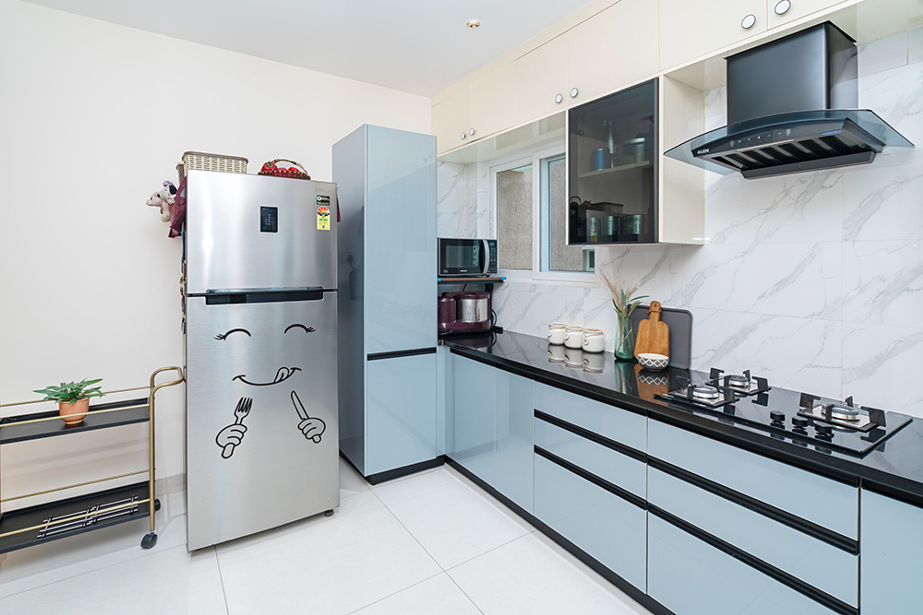 U-Shaped Kitchen Design with Blue Tall Unit and Grey Refrigerator