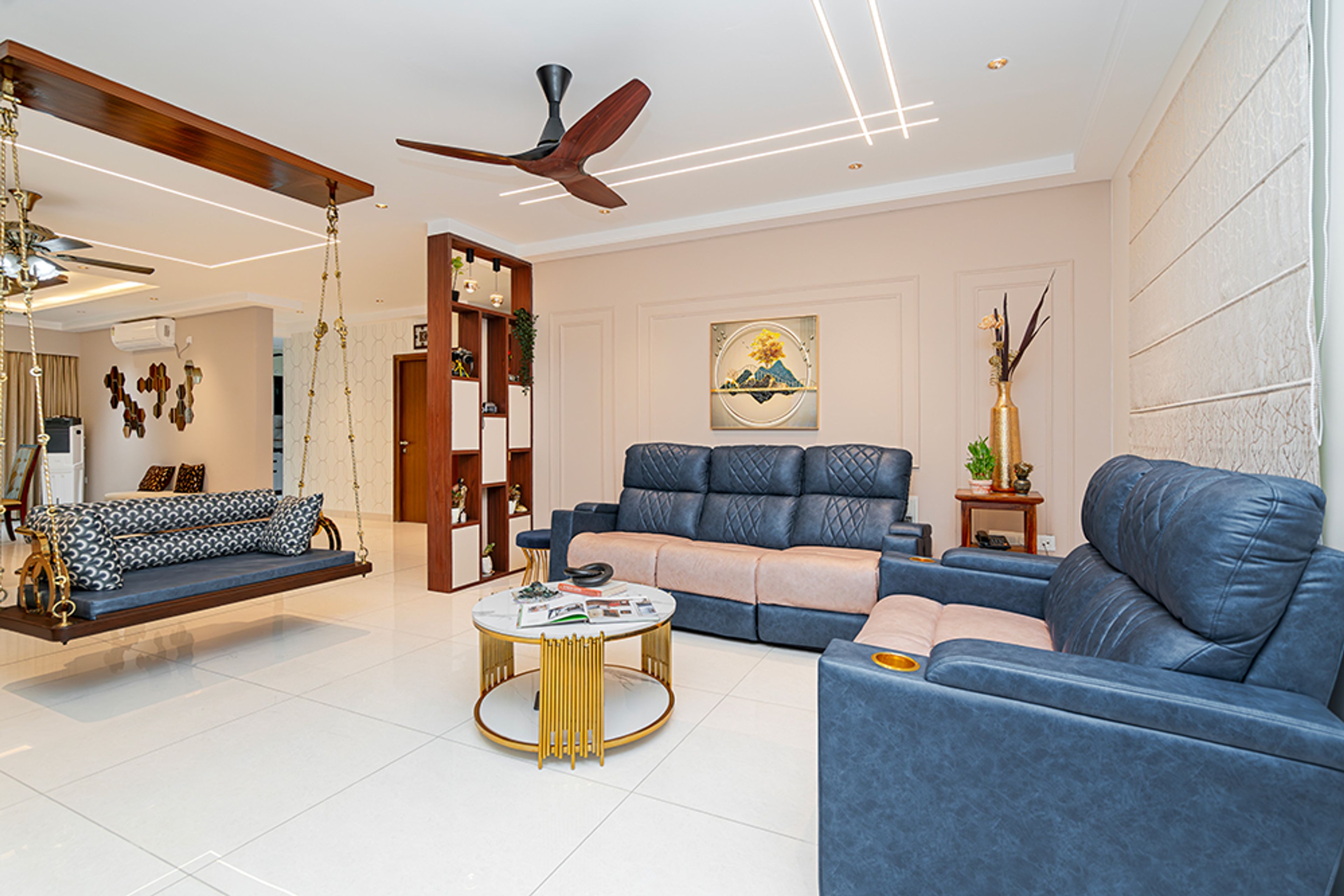 Living Room Design with Blue and Beige Sofas and Wooden Swing