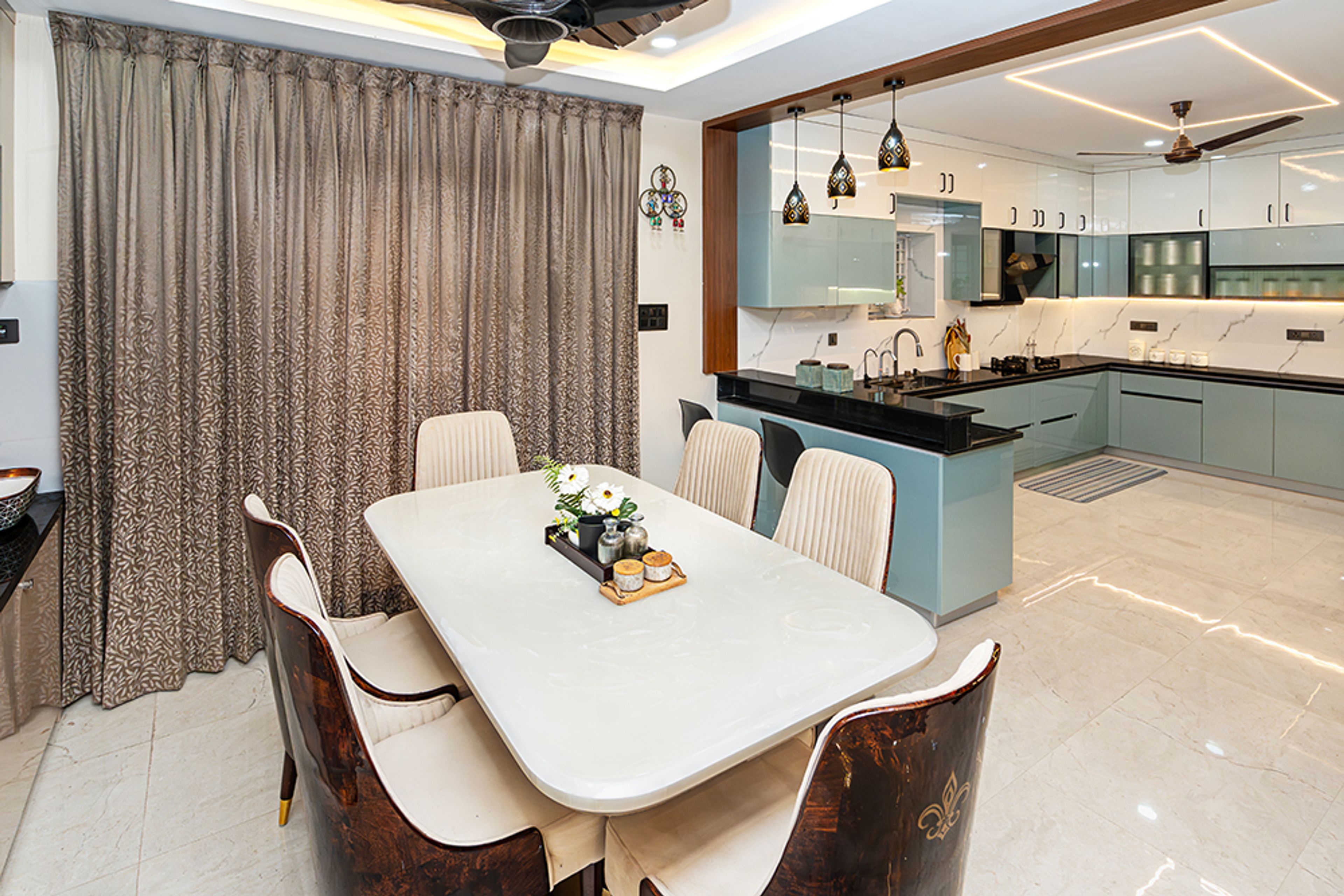 Dining Room Design with Marble Top Table, 6 Brown and Beige Chairs and U-Shaped Kitchen