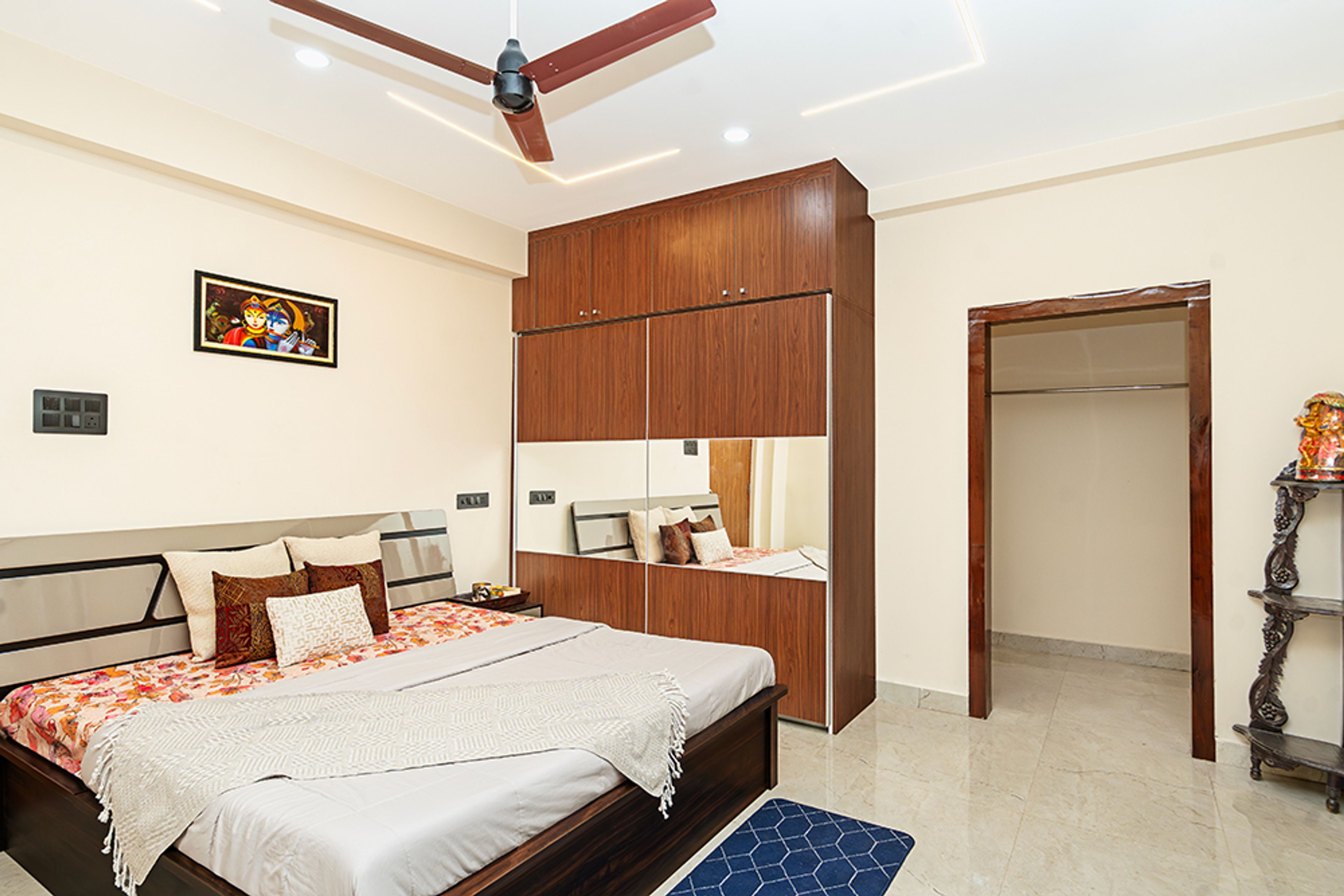 Bedroom Design with Wooden and Mirror Integrated Swing Wardrobe