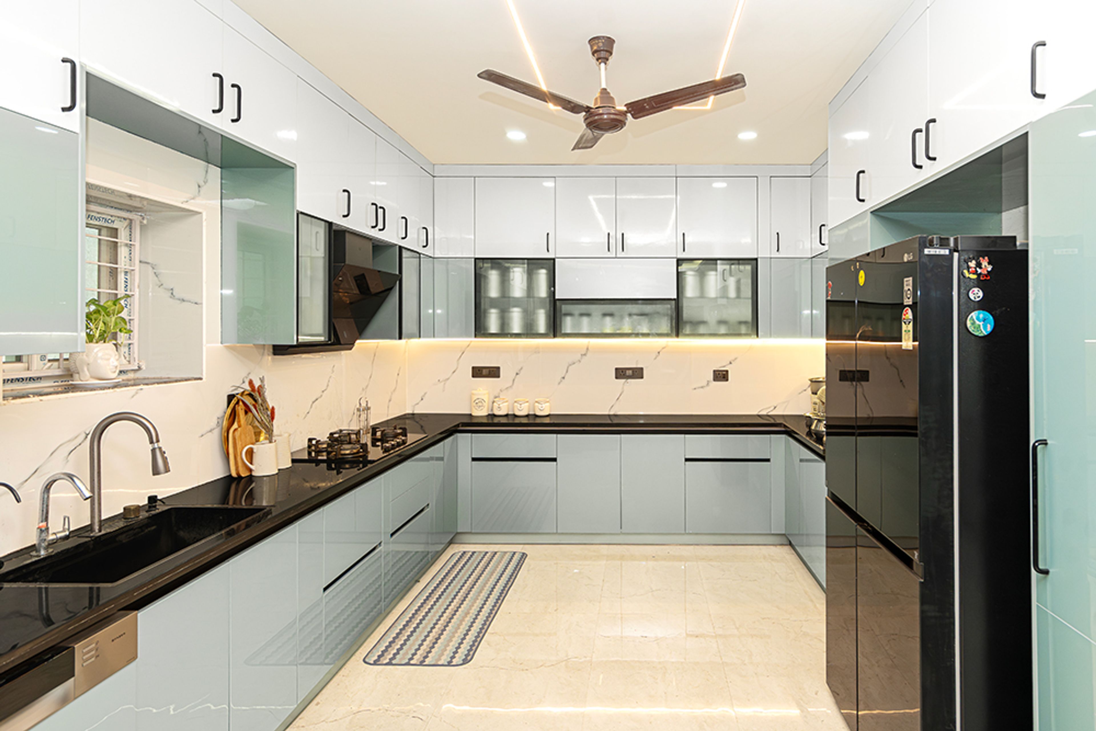 U-Shaped Kitchen Design with Greenish Blue Units and Under Cabinet Lighting