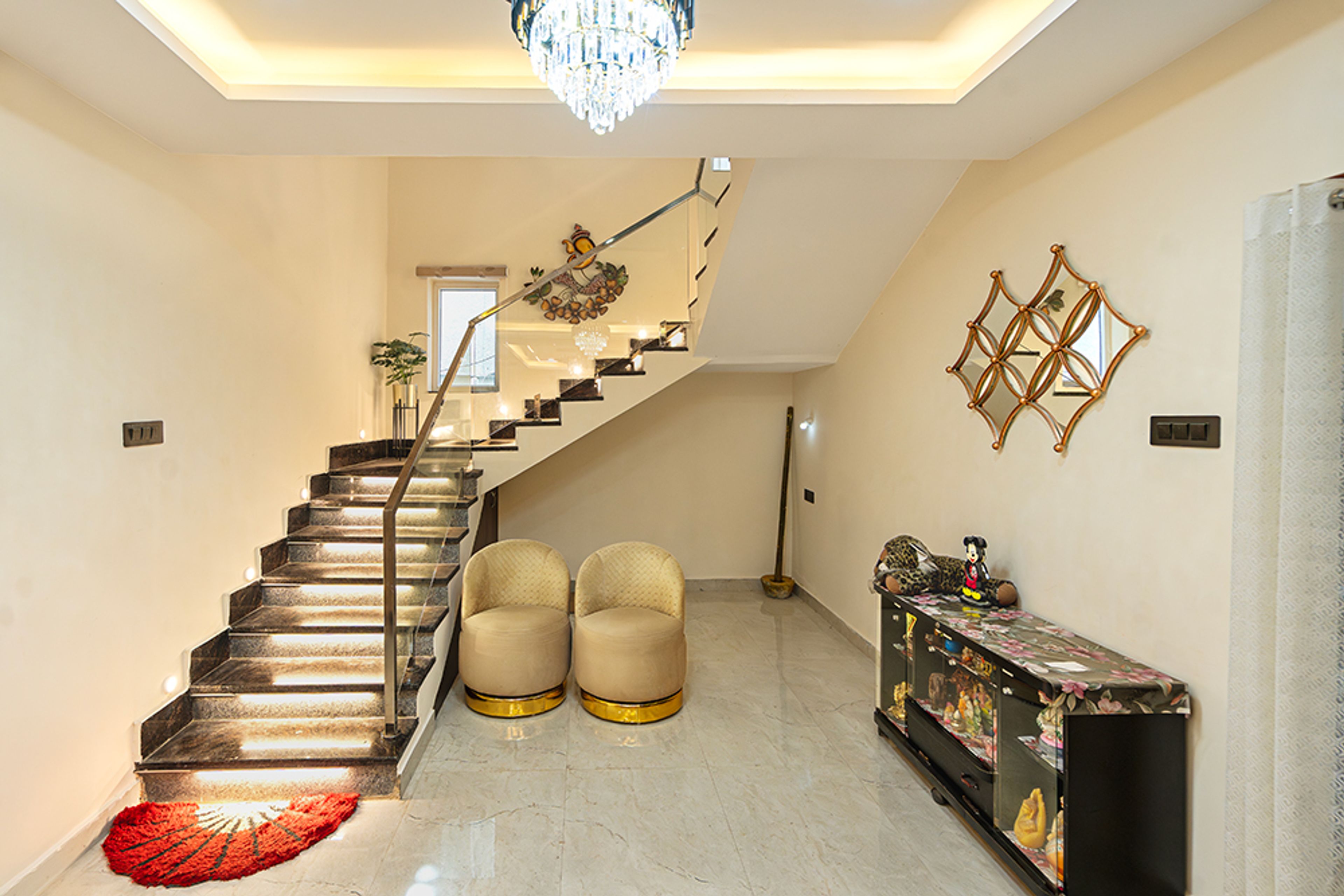 Black Marble Staircase Design With Glass Railing and LED Lighting