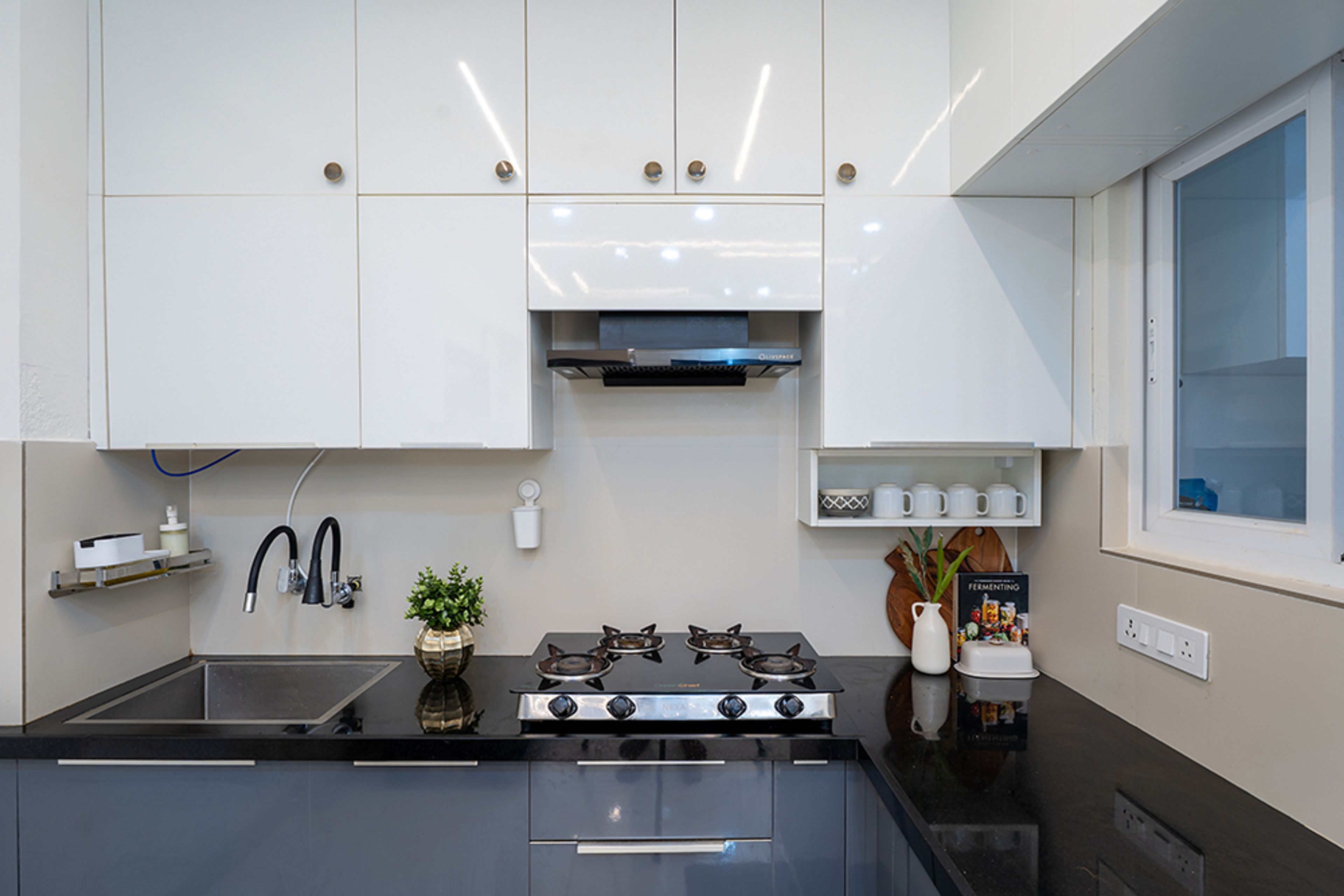 L-Shaped Kitchen Design with White Upper Cabinets and Grey Base Cabinets