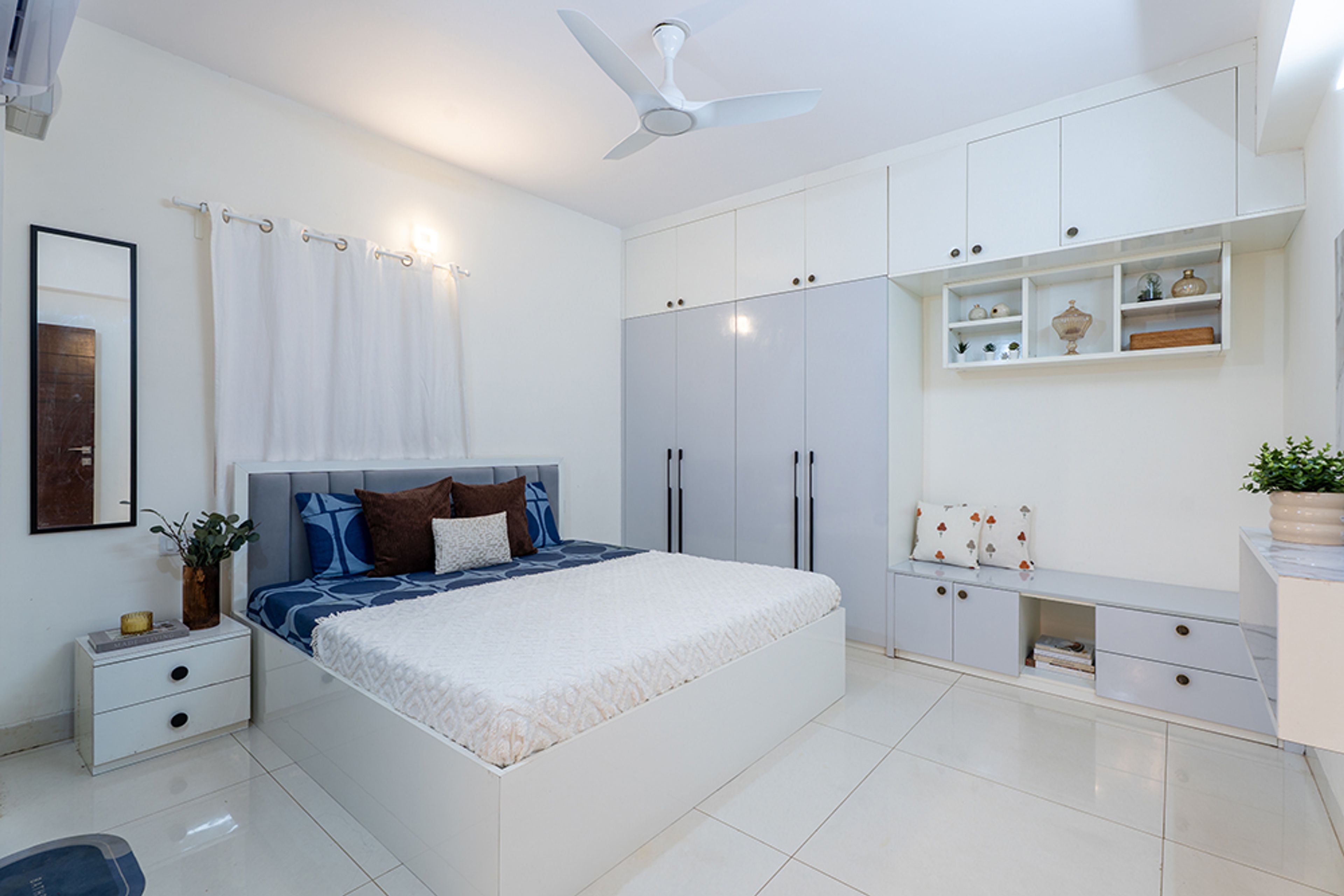 Master Bedroom Design with White and Grey Wardrobe and Wall-Mounted Mirror