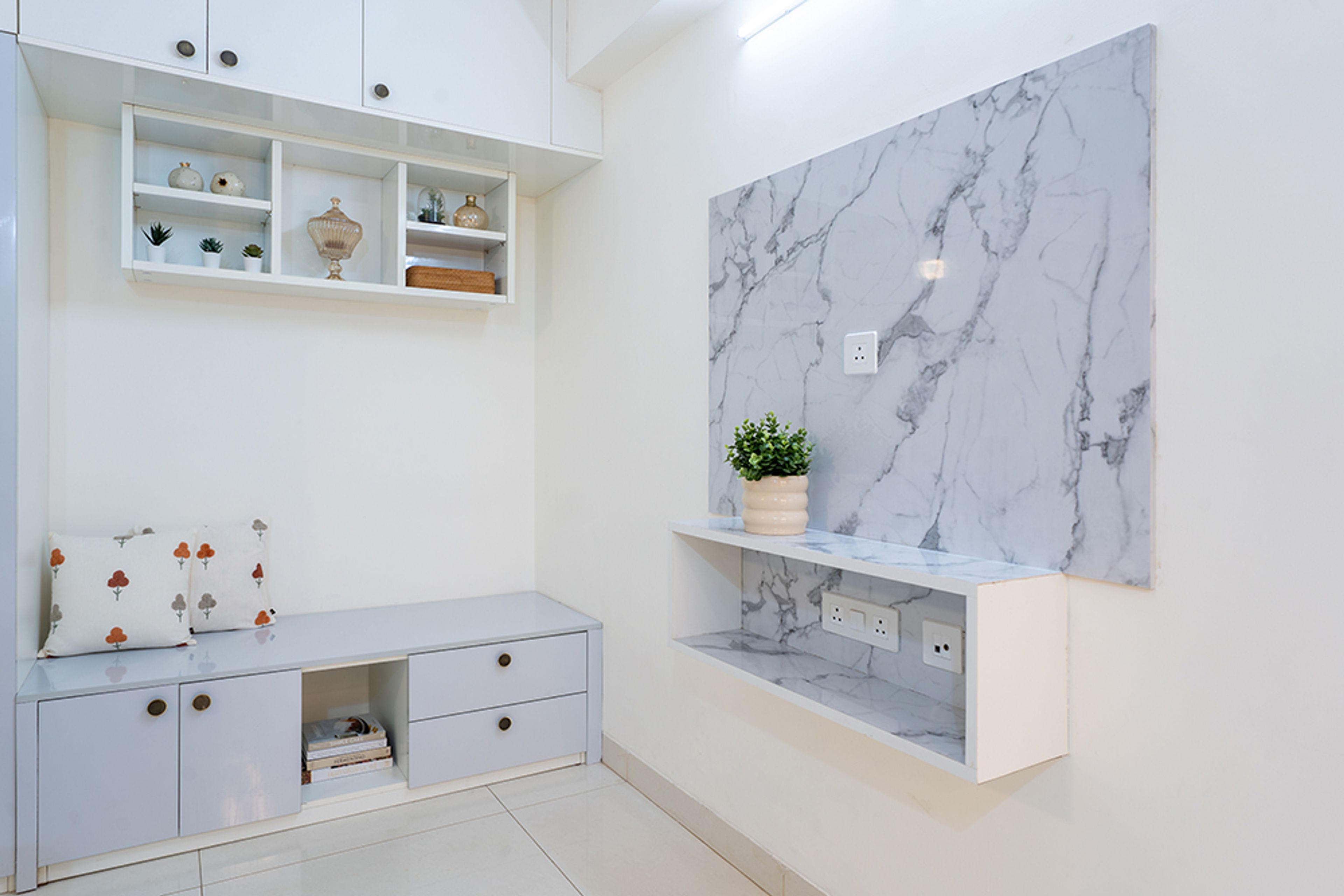 TV Unit Design with White Cabinets and Grey Marble Texture