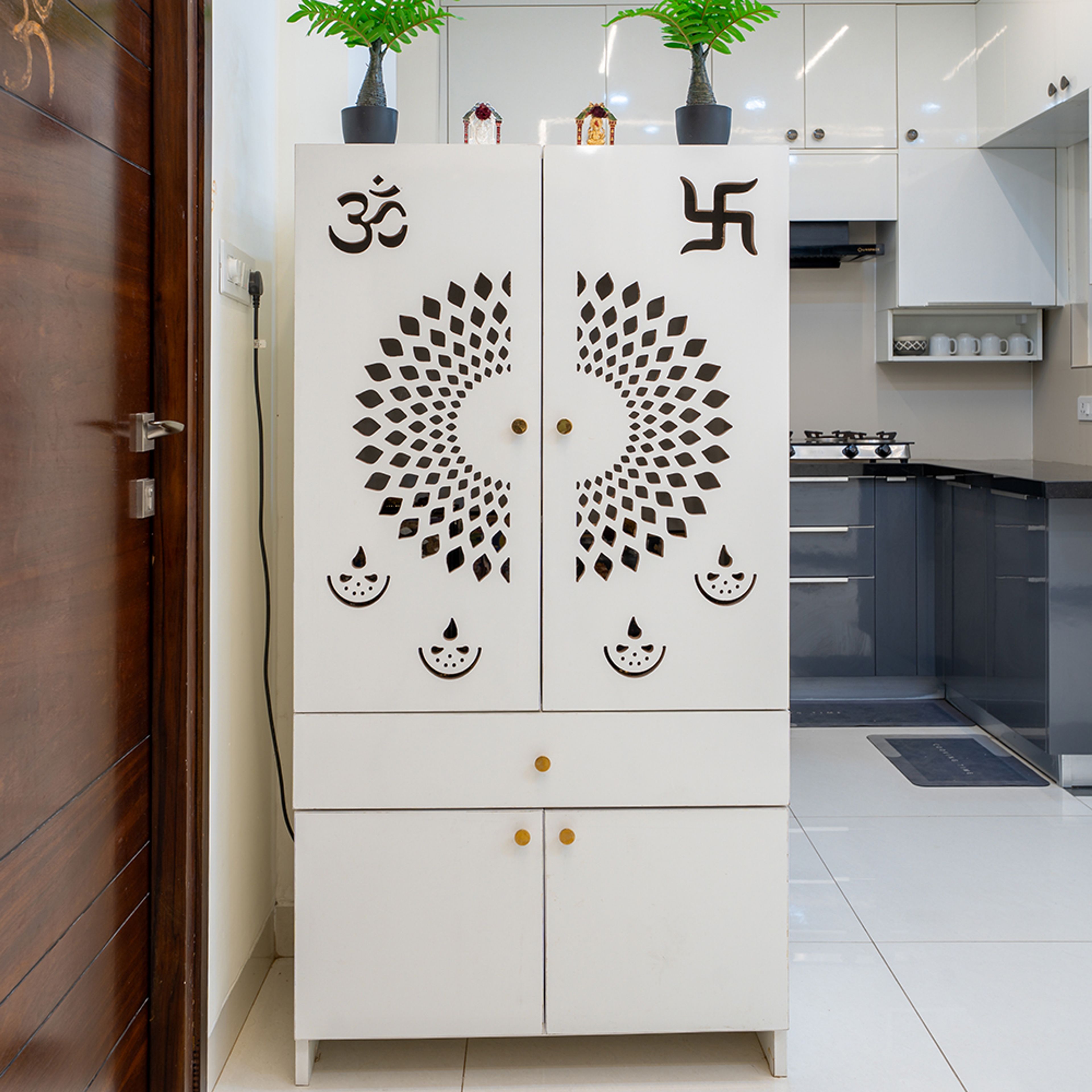 White Pooja Unit Design with Laser-Cut Patterns and Gold Knobs