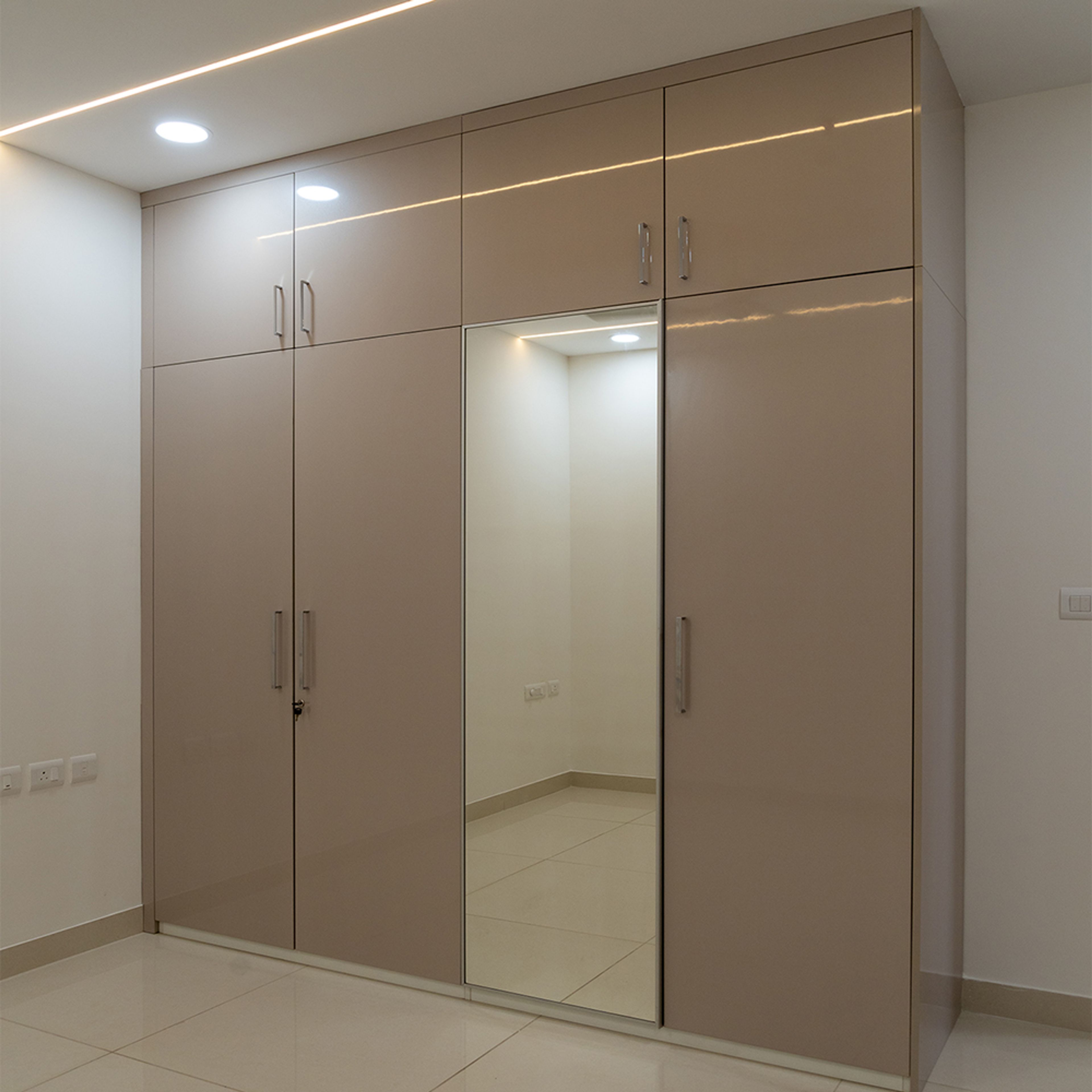 4-Door Light Brown Swing Wardrobe Design with Integrated Mirror