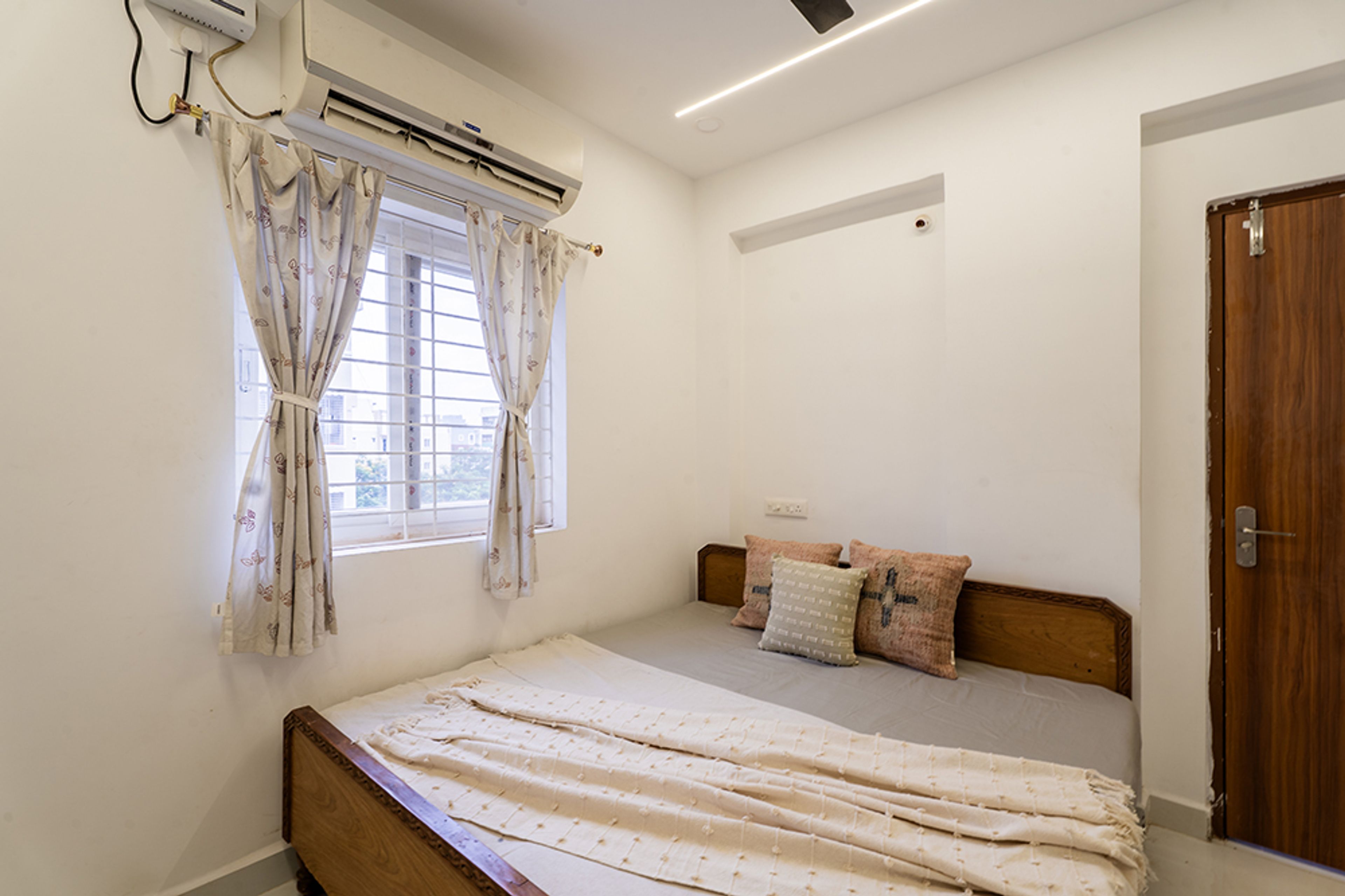Bedroom Design with Brown Bed and White Walls
