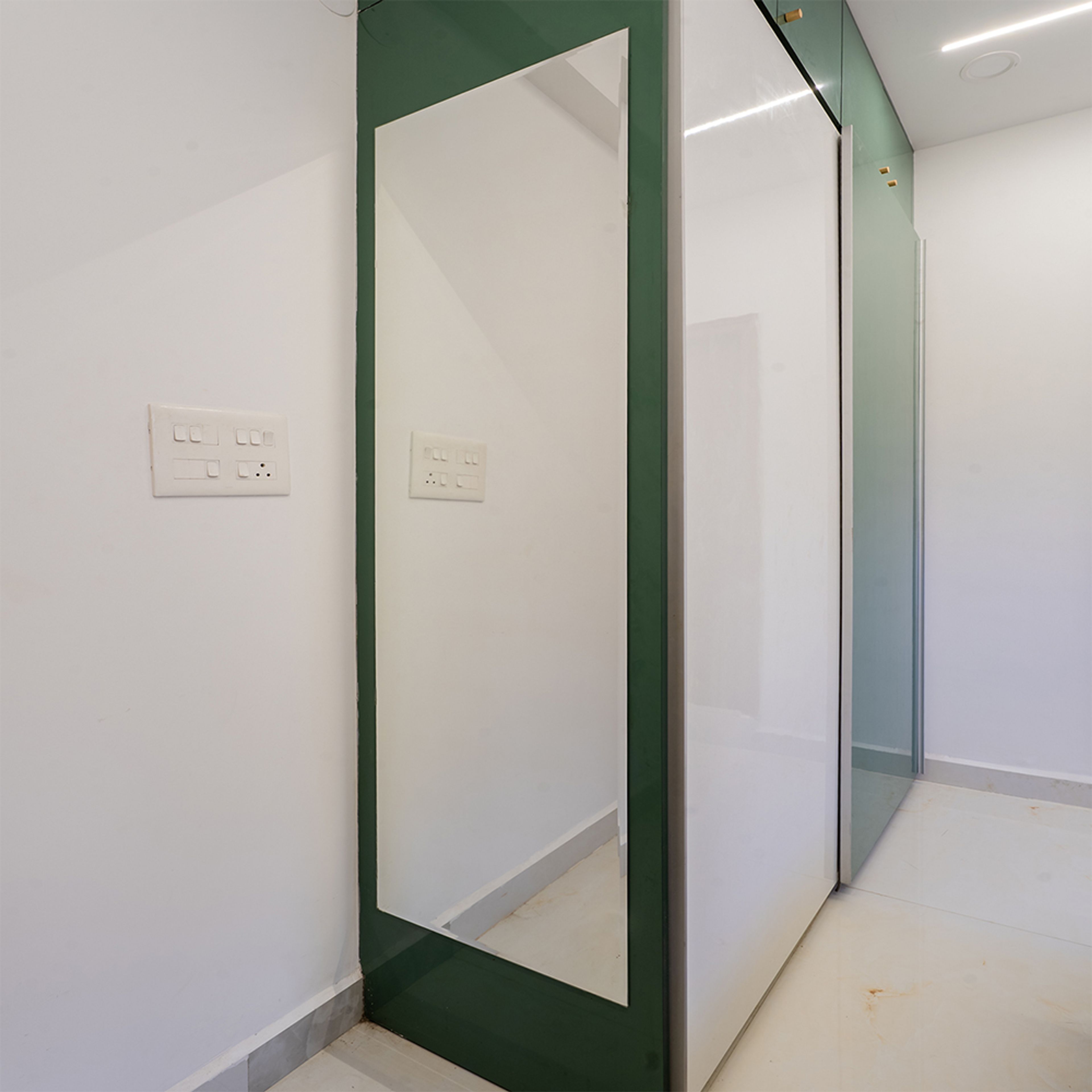 2-Door Green and White Sliding Wardrobe Design with Integrated Mirror