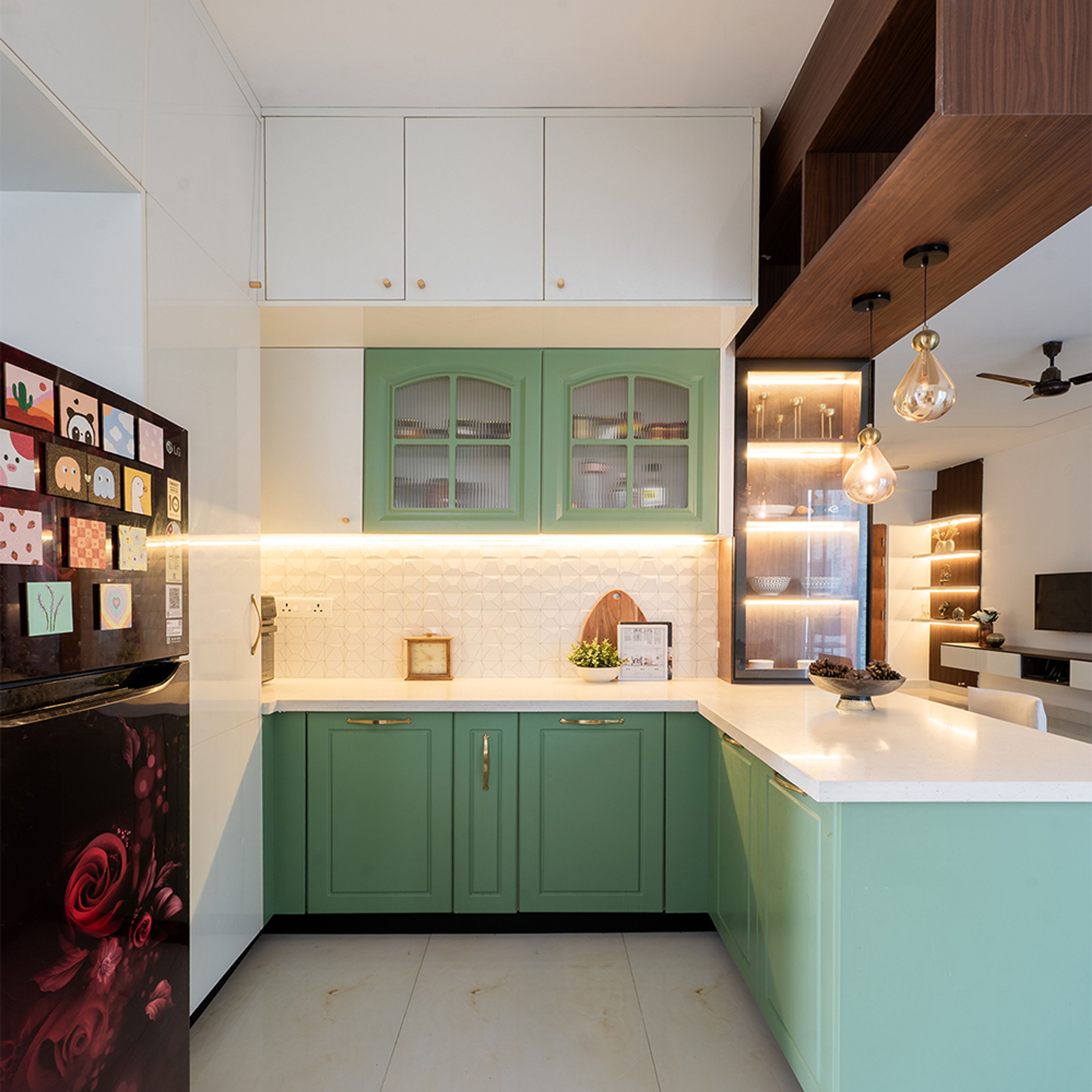 L-Shaped Kitchen Design with Green and White Cabinets and Breakfast Counter