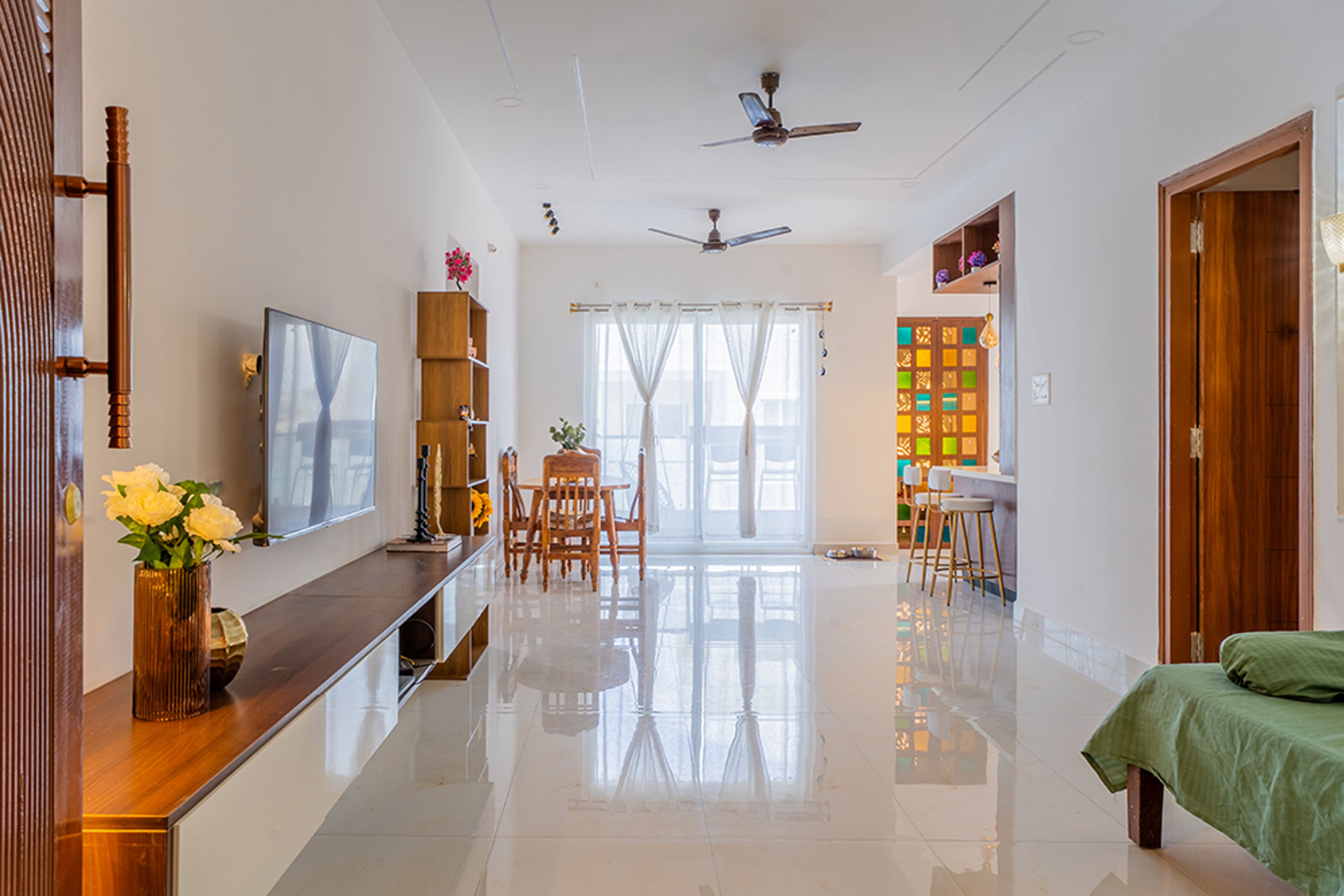 Living Room Design with Wall-Mounted Wooden TV Unit and Dining Table