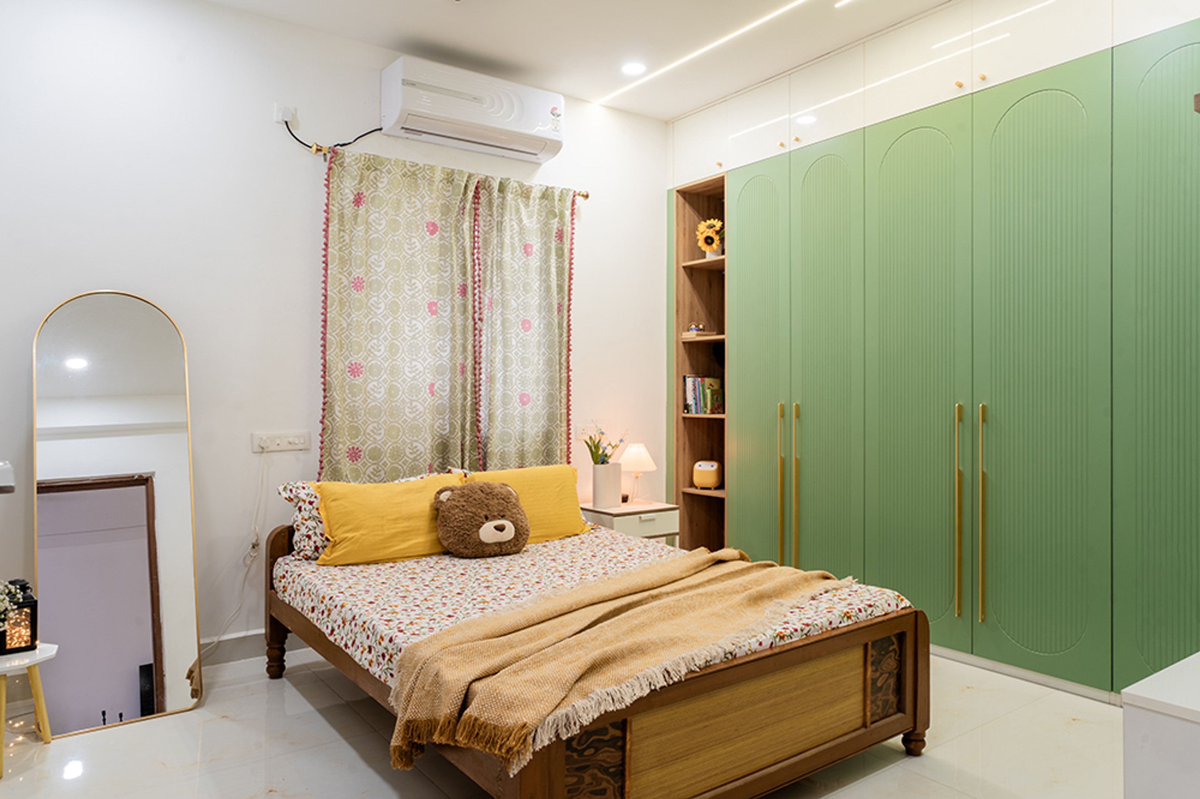 Bedroom Design with Green Wardrobe and Arched Mirror