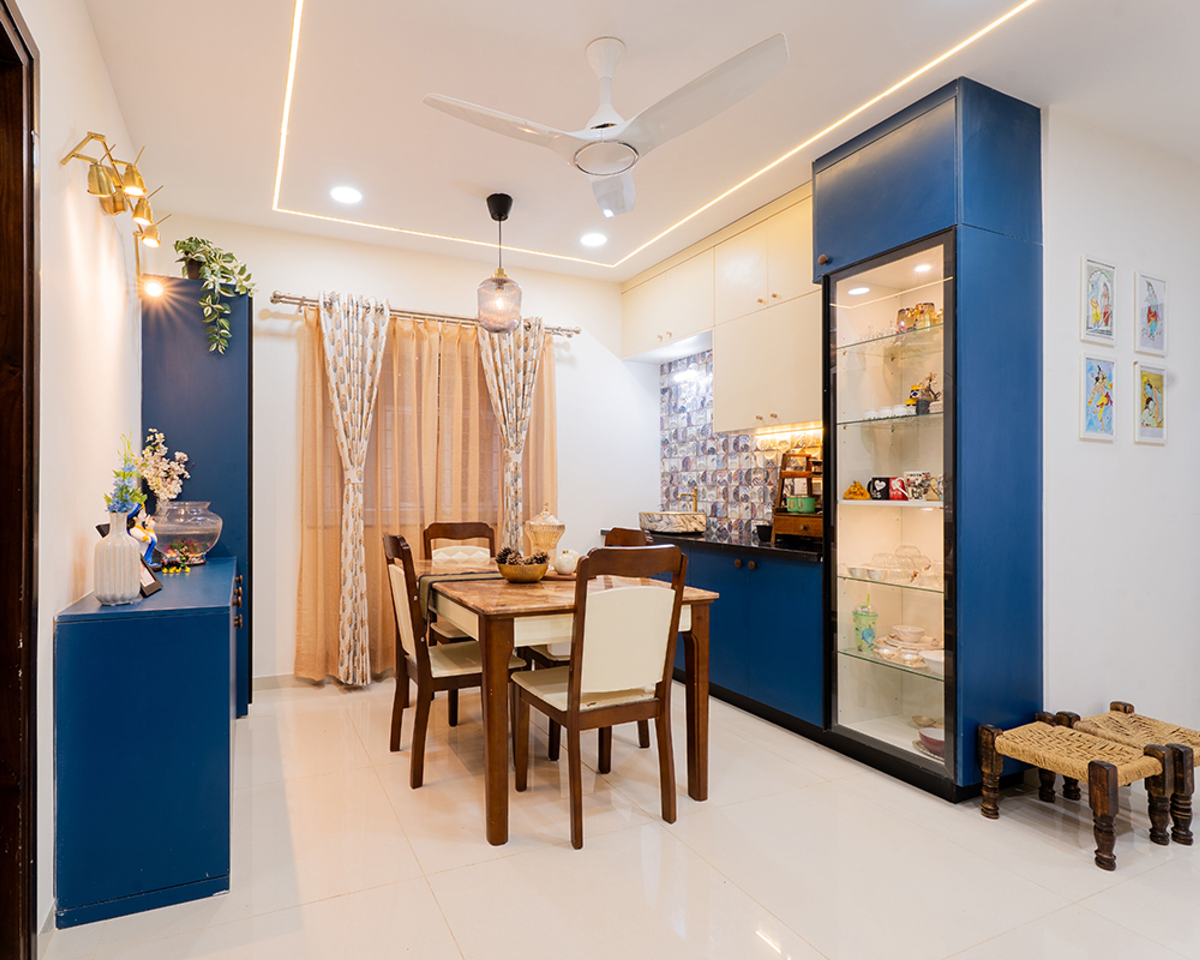 Dining Room Design with Blue and White Crockery Unit and Wooden Table