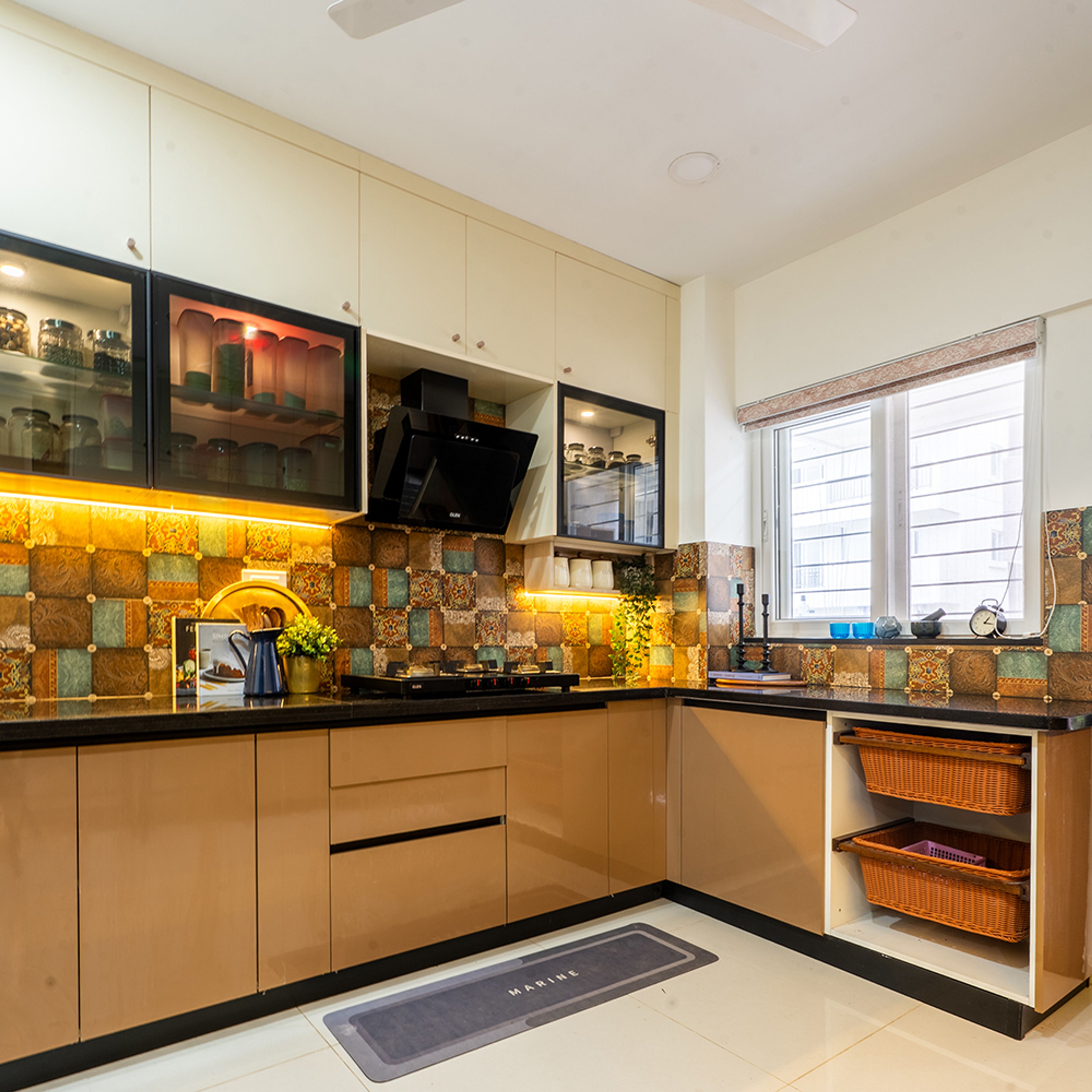 L-Shaped Kitchen Design with Brown Cabinets and Patterned Tile Backsplash