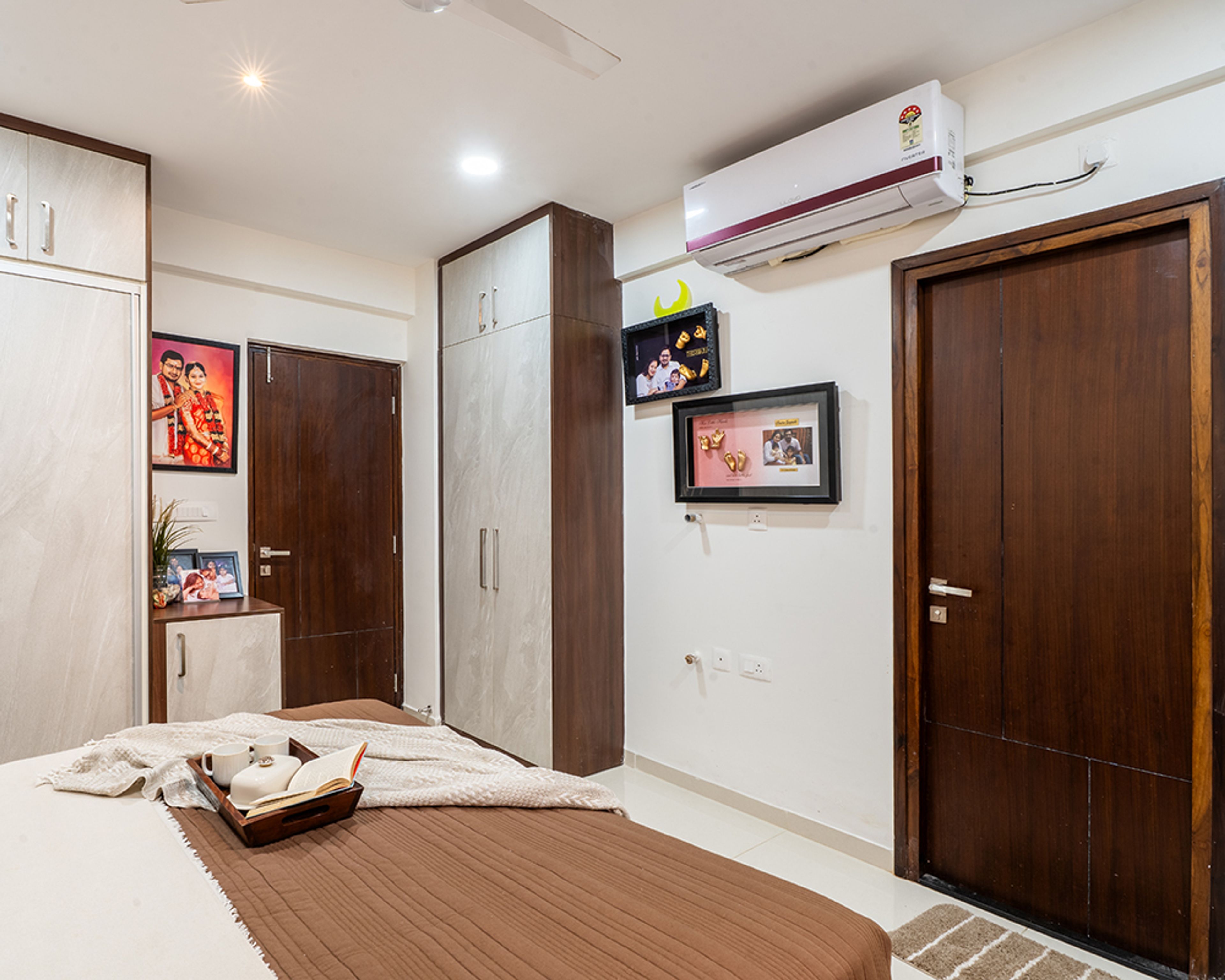 Bedroom Design with 2-Door Swing Wardrobe and Wall-Mounted Photo Frames